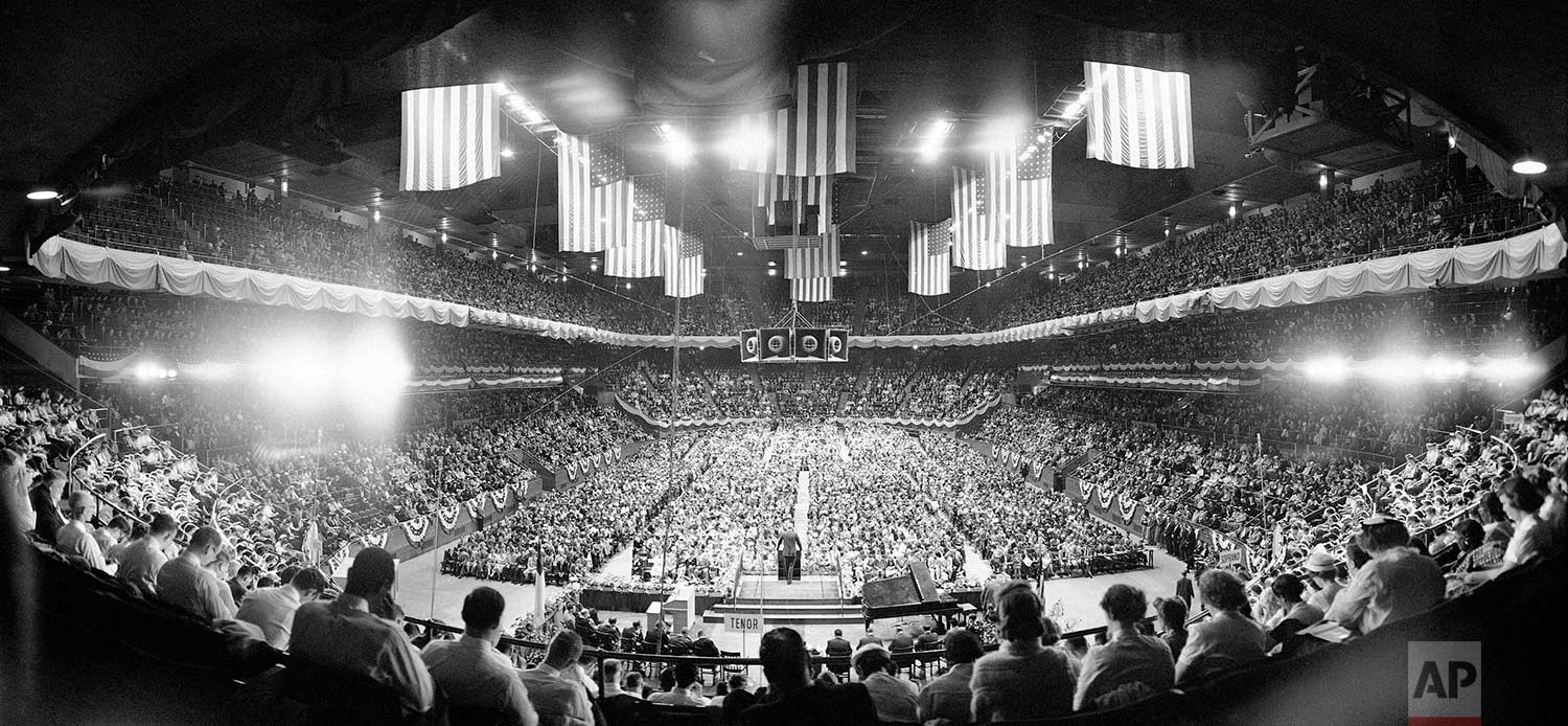 An estimated 13,000 persons sit in Madison Square Garden, New York May 16, 1967 for the second of Evangelist Billy Graham’s religious crusade in the city. Beyond the choir singers, foreground, the Baptist preacher addresses assembly from rostrum. (AP Photo/Hans Von Nolde)