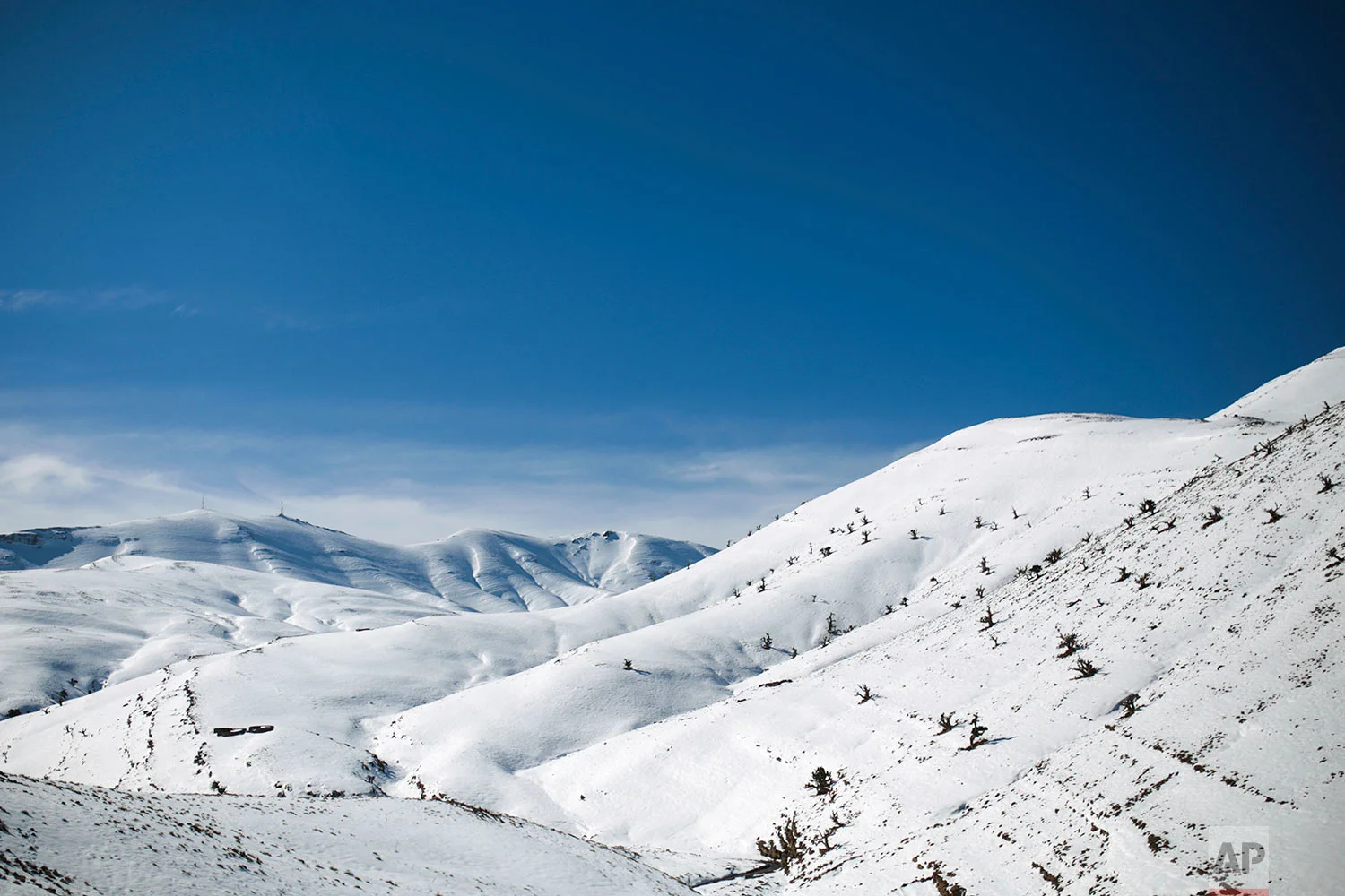 In this Thursday, Feb. 15, 2018 photo, a view of snow covered mountains in the Middle Atlas village of Tighanmin, near Azilal, central Morocco. (AP Photo/Mosa'ab Elshamy)