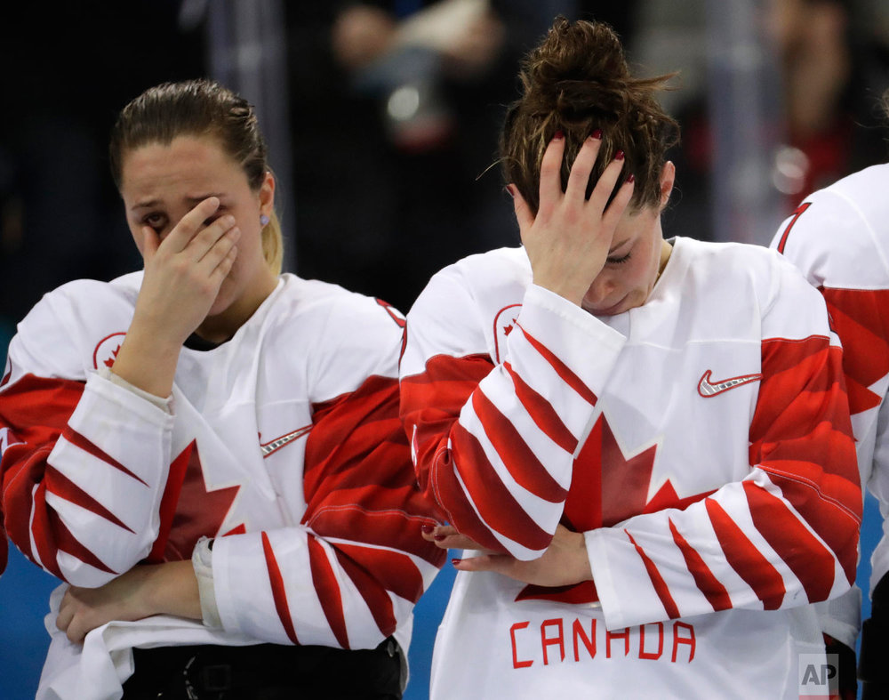 Canada players react after the women's gold medal hockey game.