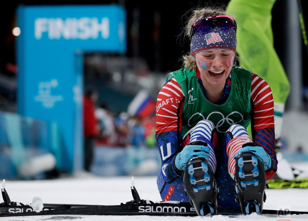 Jessica Diggins, left, of the United States, celebrates after winning the gold medal.