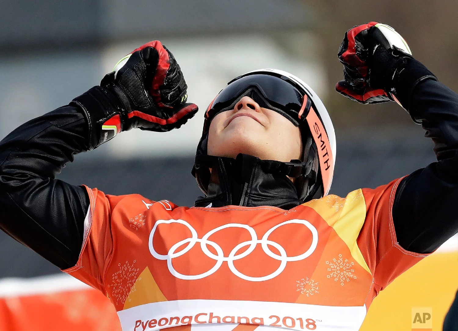 Silver medal winner Lee Sangho, of South Korea, celebrates after winning semifinal during the men's parallel giant slalom semifinal at Phoenix Snow Park at the 2018 Winter Olympics in Pyeongchang, South Korea, Saturday, Feb. 24, 2018. (AP Photo/Lee Jin-man)