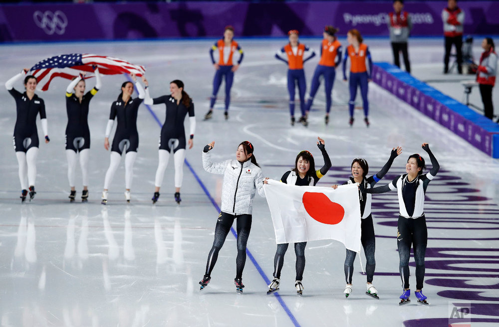  Gold medalist team Japan, front, and bronze medalist team U.S.A. celebrate, while silver medalist team Netherlands appears dejected after the women's team pursuit speedskating race at the Gangneung Oval at the 2018 Winter Olympics in Gangneung, Sout