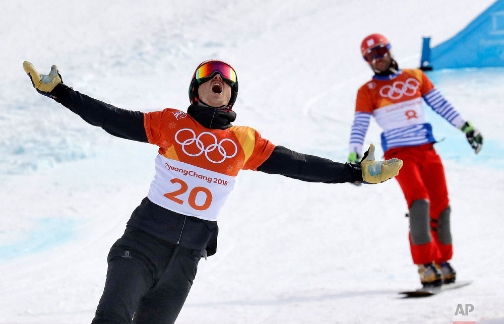  Bronze medal winner Zan Kosir, of Slovenia, celebrates after the small men's parallel giant slalom final at Phoenix Snow Park at the 2018 Winter Olympics in Pyeongchang, South Korea, Saturday, Feb. 24, 2018. (AP Photo/Lee Jin-man) 