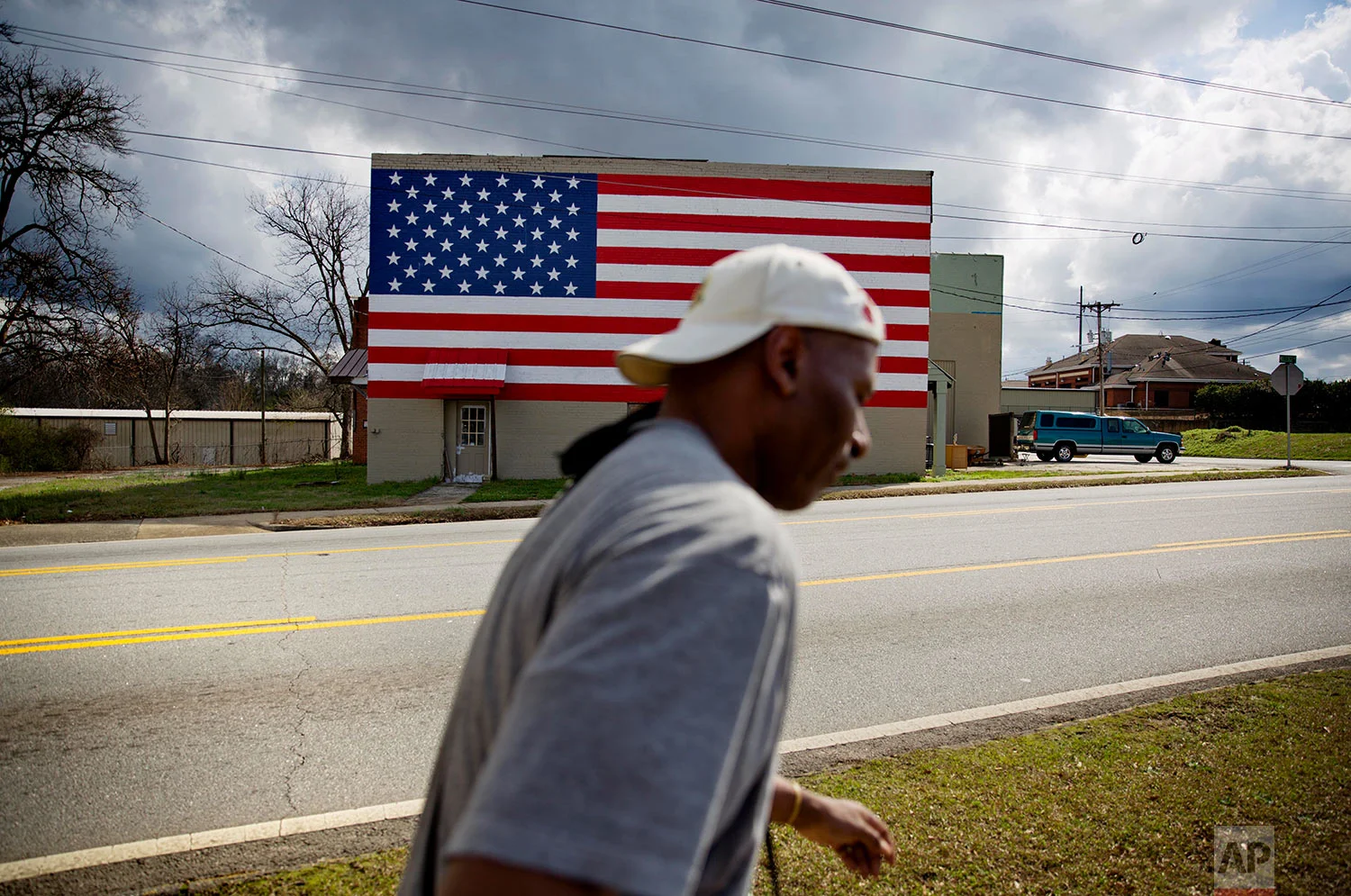 An American flag decorates a building in Monroe, Ga., in rural Walton County, Thursday, Feb. 22, 2018. (AP Photo/David Goldman)