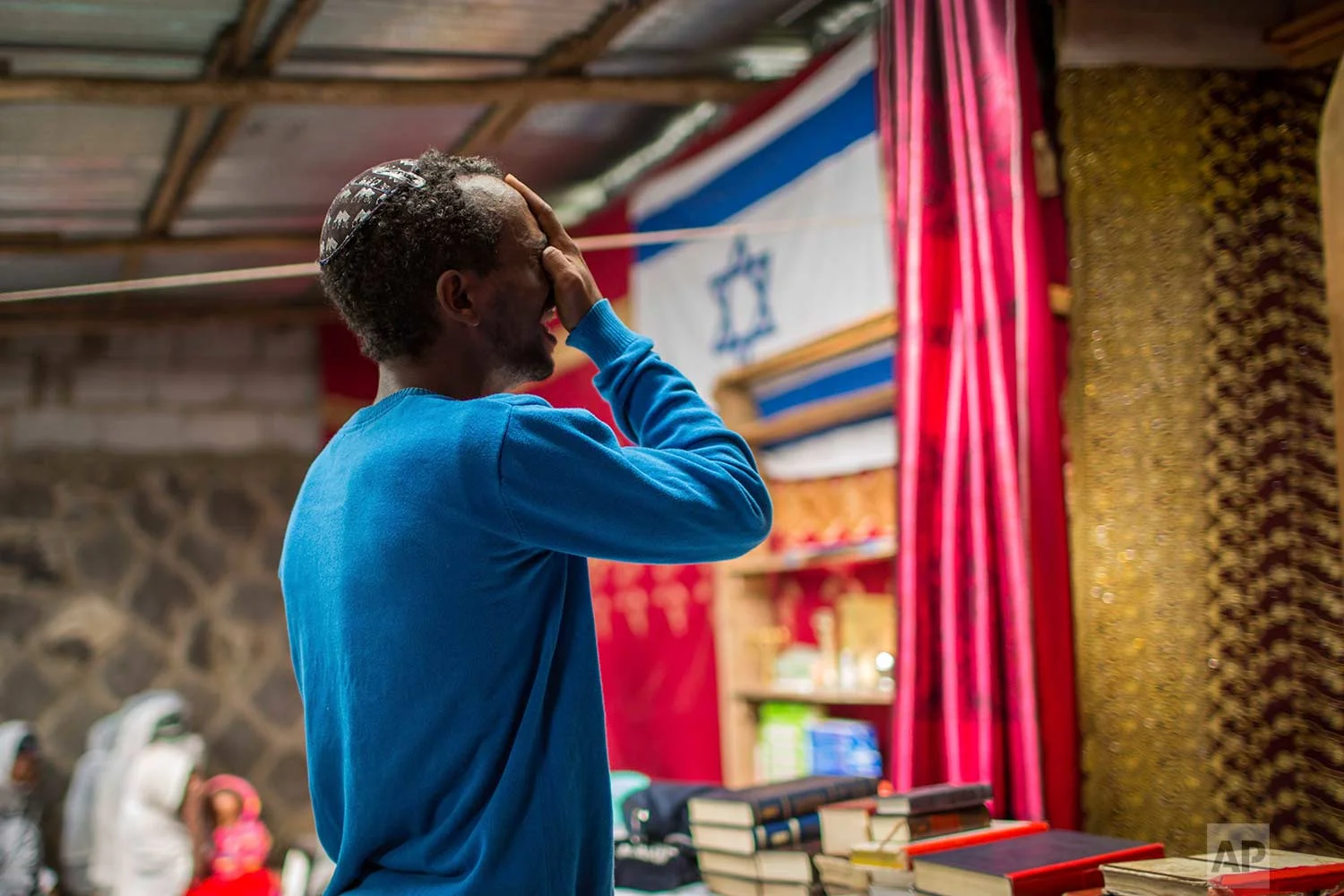 Members of Ethiopia's Jewish community attend a solidarity event for their relatives in Israel, at the synagogue in Addis Ababa, Ethiopia Wednesday, Feb. 28, 2018. (AP Photo/Mulugeta Ayene)