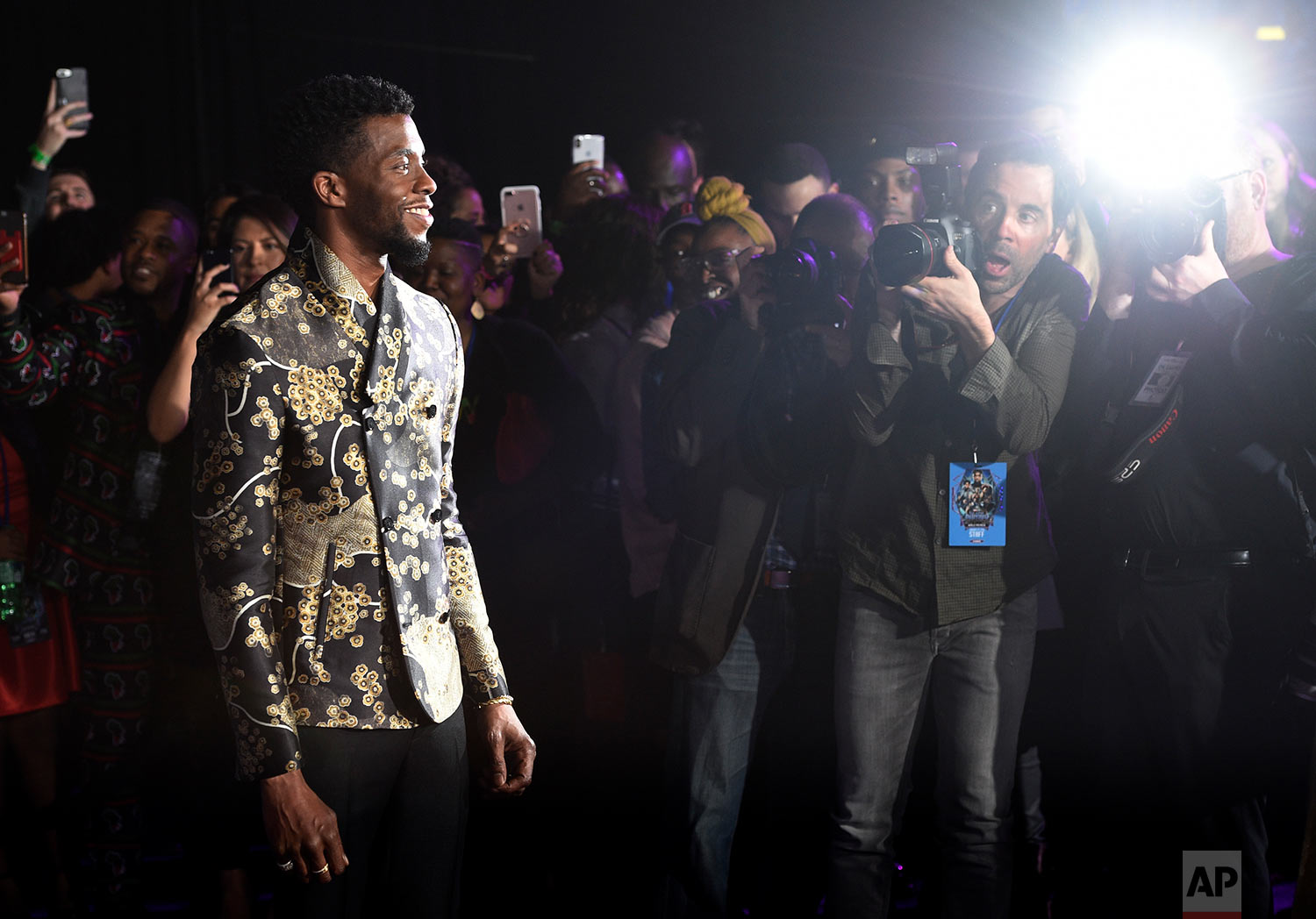 Chadwick Boseman, left, star of "Black Panther," arrives at the premiere of the film at The Dolby Theatre on Monday, Jan. 29, 2018, in Los Angeles. (Photo by Chris Pizzello/Invision/AP)