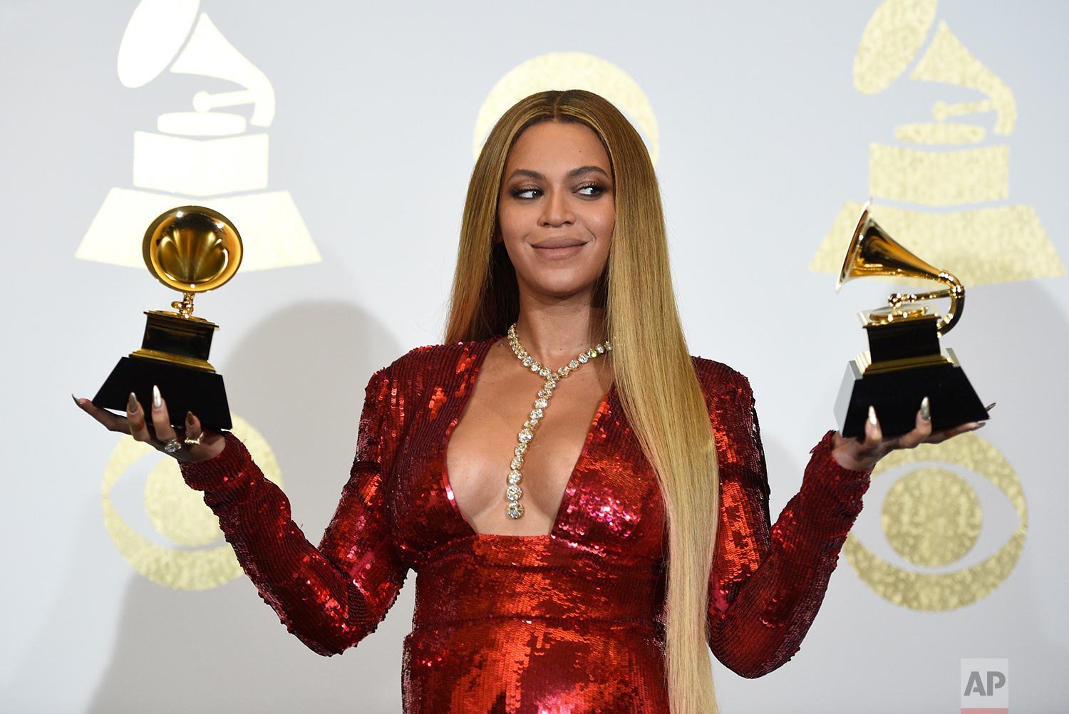  Beyonce poses in the press room with the awards for best music video for "Formation" and best urban contemporary album for "Lemonade" at the 59th annual Grammy Awards at the Staples Center on Sunday, Feb. 12, 2017, in Los Angeles. (Photo by Chris Pi