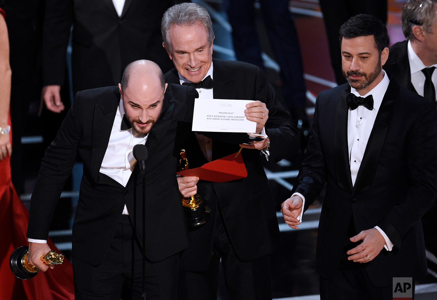 Jordan Horowitz, producer of "La La Land," shows the envelope revealing "Moonlight" as the true winner of best picture at the Oscars on Sunday, Feb. 26, 2017, at the Dolby Theatre in Los Angeles. Presenter Warren Beatty and host Jimmy Kimmel look on