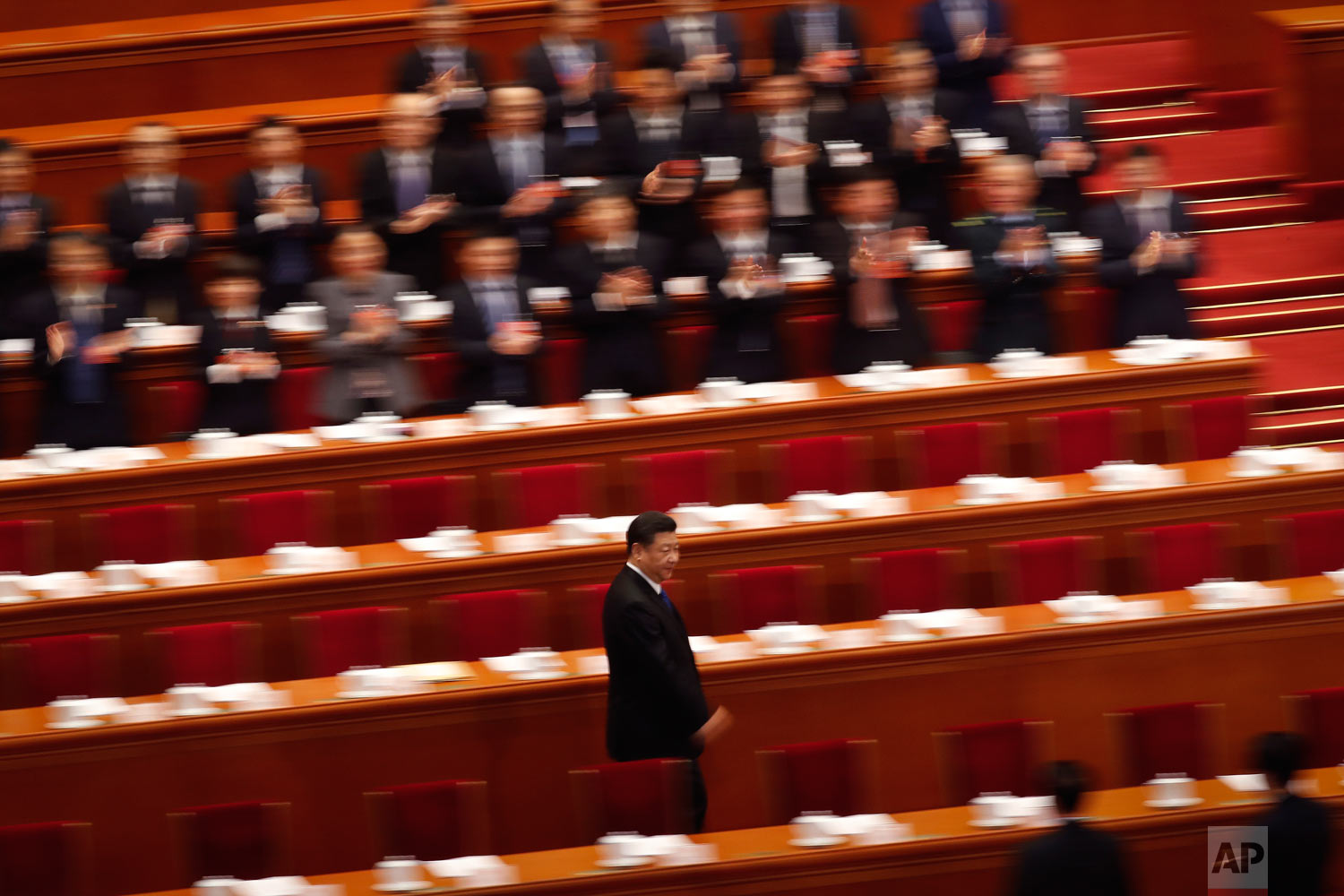  Delegates applaud as President Xi Jinping arrives for a plenary session of China's National People's Congress (NPC) at the Great Hall of the People in Beijing on Tuesday, March 13, 2018. On Sunday, China's legislature scrapped a two-term limit on th