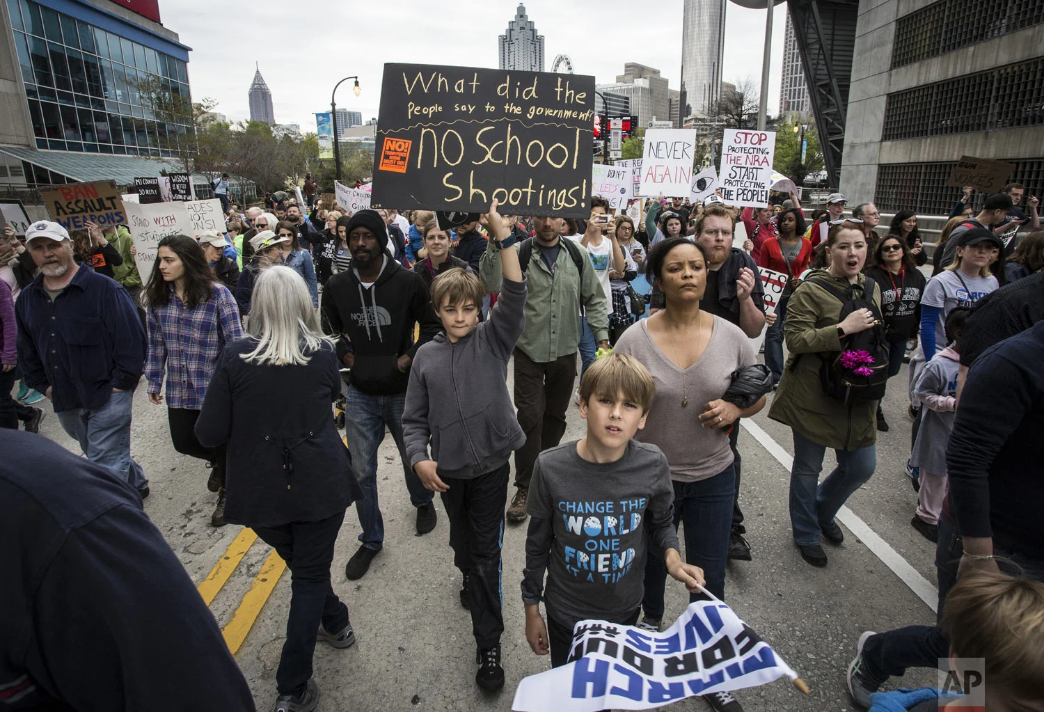 Thousands of protesters march through the streets of Atlanta on Saturday, March 24, 2018. Participants in Atlanta and across the nation rallied against gun violence and in support of stricter gun control. (AP Photo/Ron Harris)