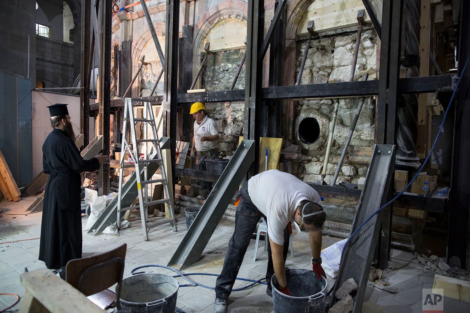  In this Monday, Sept. 19, 2016 photo, a Greek conservation team begin renovation of the Tomb of Jesus in the Church of the Holy Sepulchre in Jerusalem's Old City.  (AP Photo/Oded Balilty) 