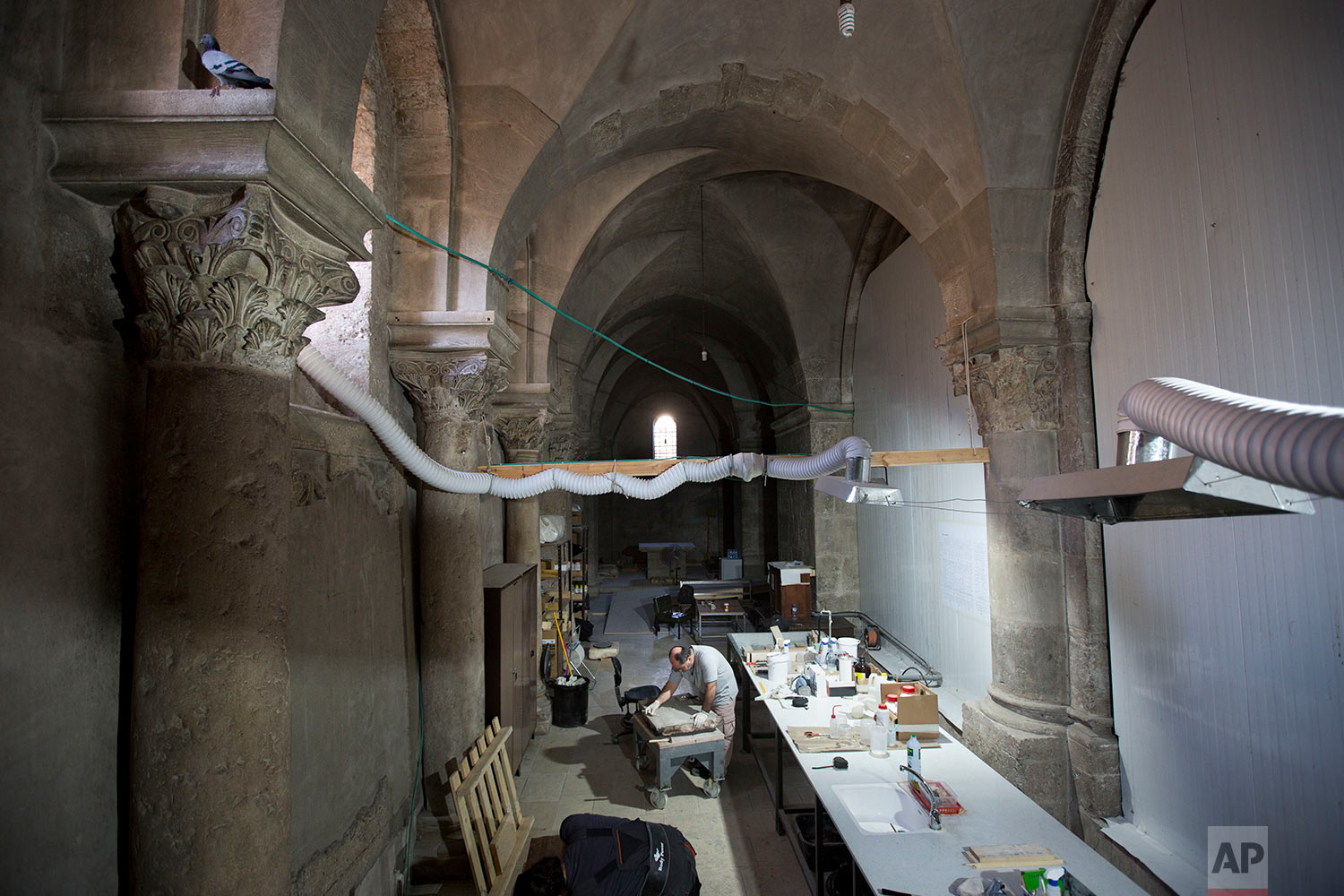  Renovation of Jesus' tomb in the Church of the Holy Sepulchre in Jerusalem's old city in Jerusalem, Israel,  Saturday, Oct. 8, 2016. (AP Photo/Oded Balilty) 