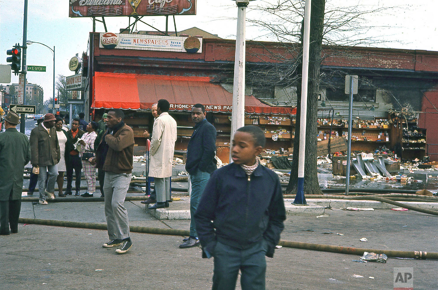  Torn-down newsstand on 14th and Kenyon Streets NW following rioting after the assassination of Dr. Martin Luther King, Jr., Saturday, April 6, 1968. (Photo/Darrell C. Crain/DC Public Library Specials Collections) 

 