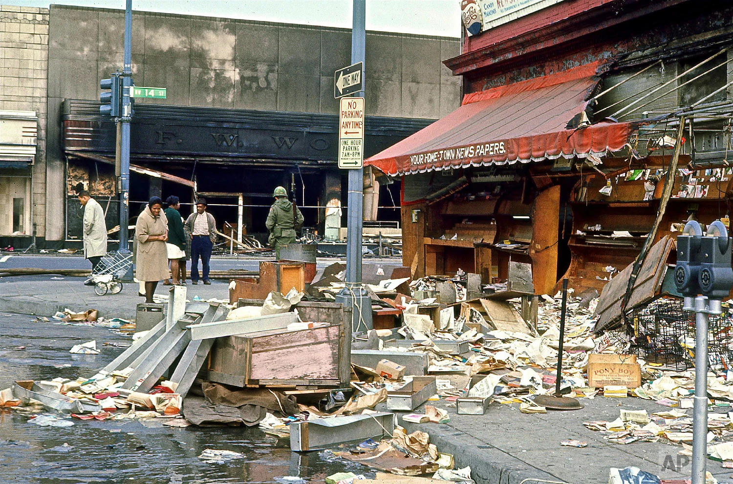Torn-down newsstand on 14th and Kenyon Streets NW following rioting after the assassination of Dr. Martin Luther King, Jr., Saturday, April 6, 1968. (Photo/Darrell C. Crain/DC Public Library Specials Collections)