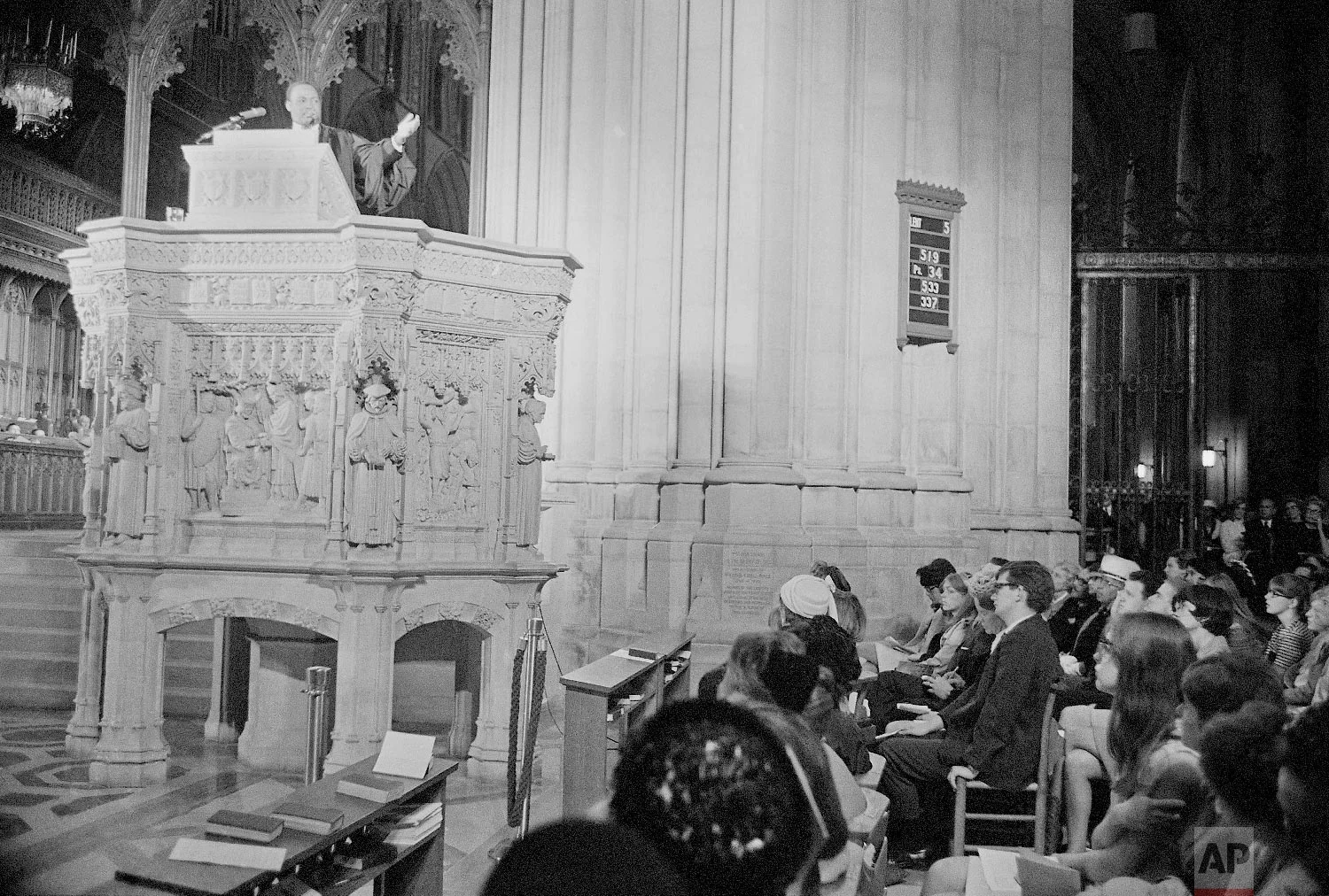 Rev. Dr. Martin Luther King, left, who heads the Southern Christian Leadership Conference, addresses a capacity crowd from the pulpit at the National Cathedral in Washington, D.C., March 31, 1968. King spoke from the Cathedral's Canterbury Pulpit and it would be his last Sunday sermon before he was assassinated later that week in Memphis. (AP Photo/John Rous)