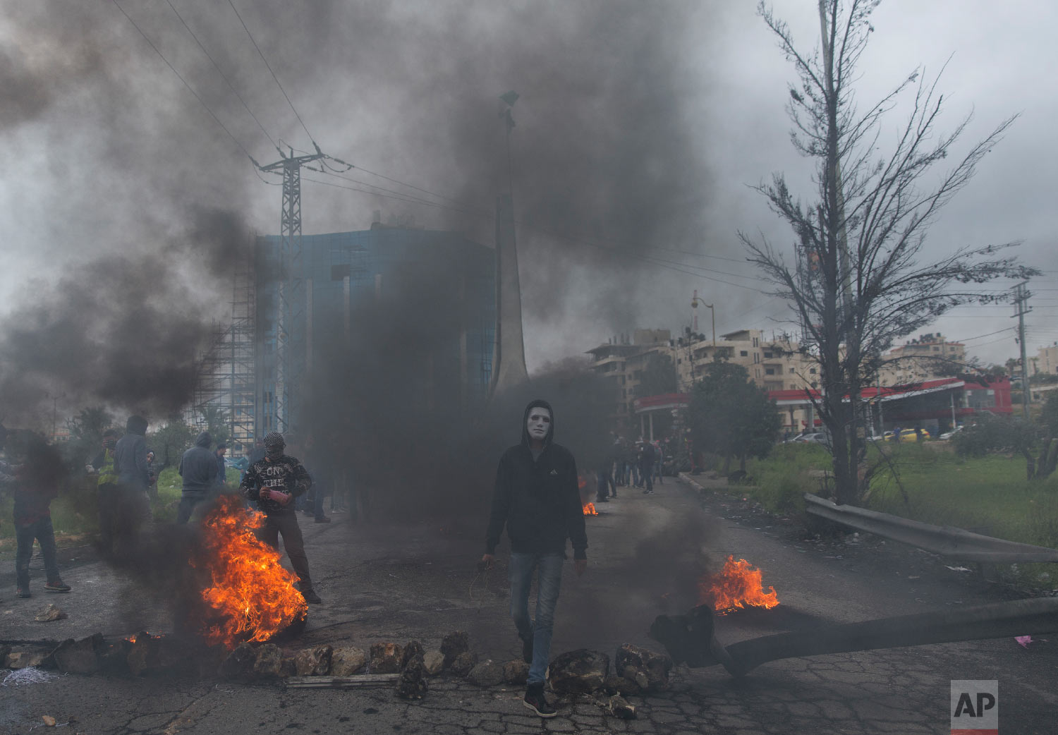 Palestinian protesters clash with Israeli troops following a protest to mark the Land Day in the West Bank city of Ramallah, Friday, March 30, 2018. (AP Photo/Nasser Nasser)
