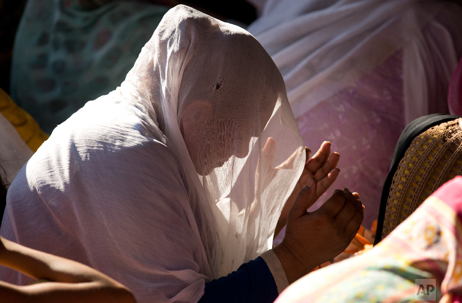 A Pakistani Christian woman prays during a Good Friday service at a church in Islamabad, Pakistan, Friday, March 30 2018. Christians all over the world attend mock crucifixions and passion plays that mark the day Jesus was crucified, known to Christians as Good Friday. (AP Photo/B.K. Bangash)