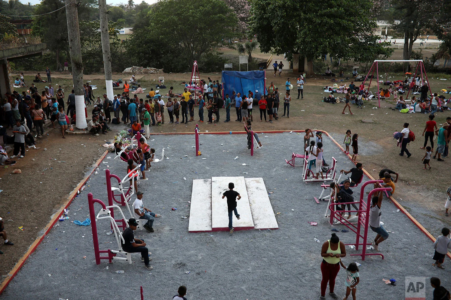 Central American migrants at a sports center in Matias Romero, Oaxaca state, Mexico, late Monday, April 2, 2018. (AP Photo/Felix Marquez)