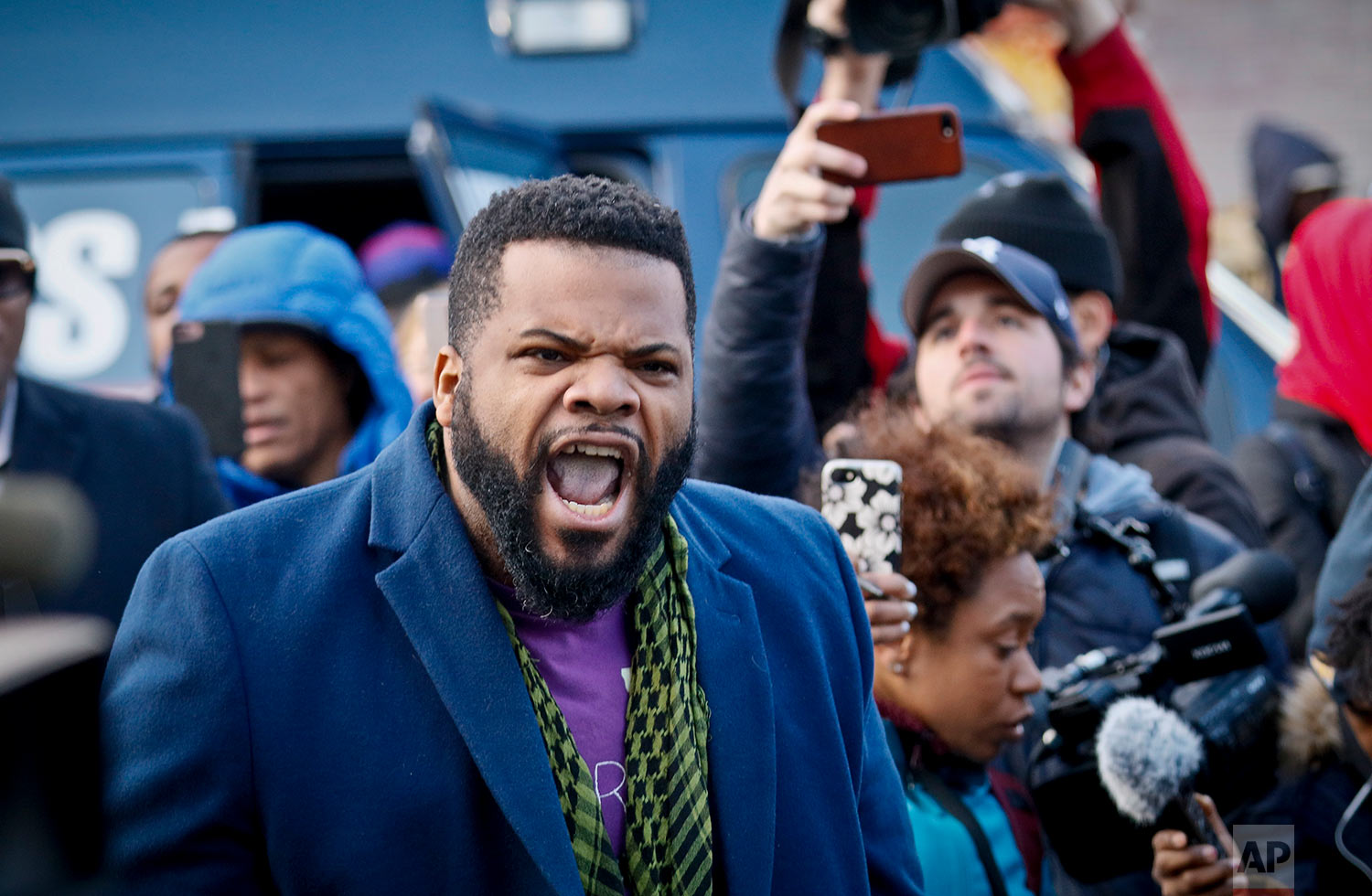Neighborhood resident Clinton Dyer shouts, "He was innocent!" as he interrupts community leaders speaking, Thursday April 5, 2018, at a vigil for Saheed Vassell, a 34-year-old welder and father of a teenage son who was fatally shot by New York Police Department officers on Wednesday, in the Brooklyn borough of New York. (AP Photo/Bebeto Matthews) 