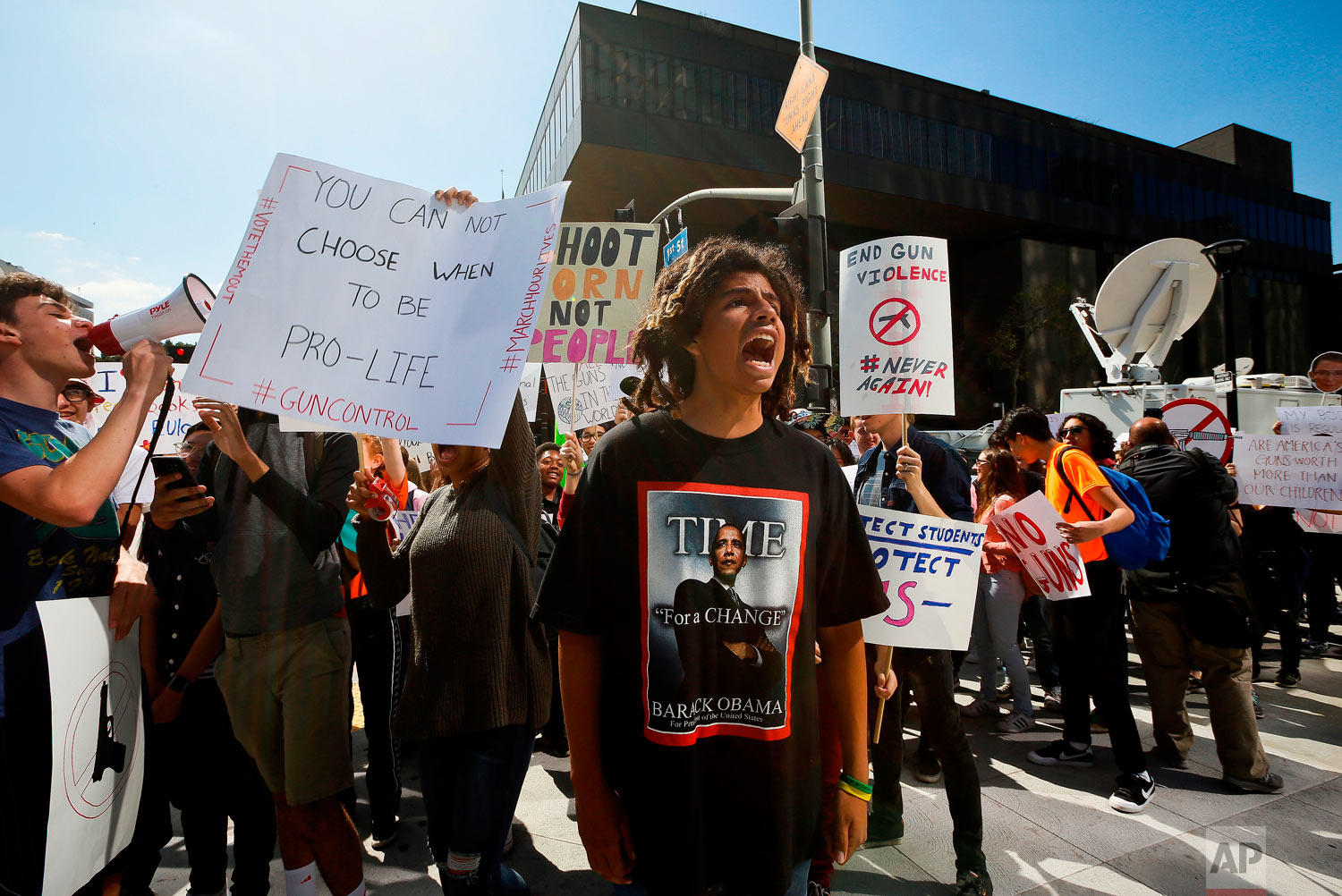  High school student Sebastian Chavez, center, joins hundred of students walking out of school to rally against against gun violence, Friday, April 20, 2018, in downtown Los Angeles Friday, April 20, 2018. Protests were held across the country Friday