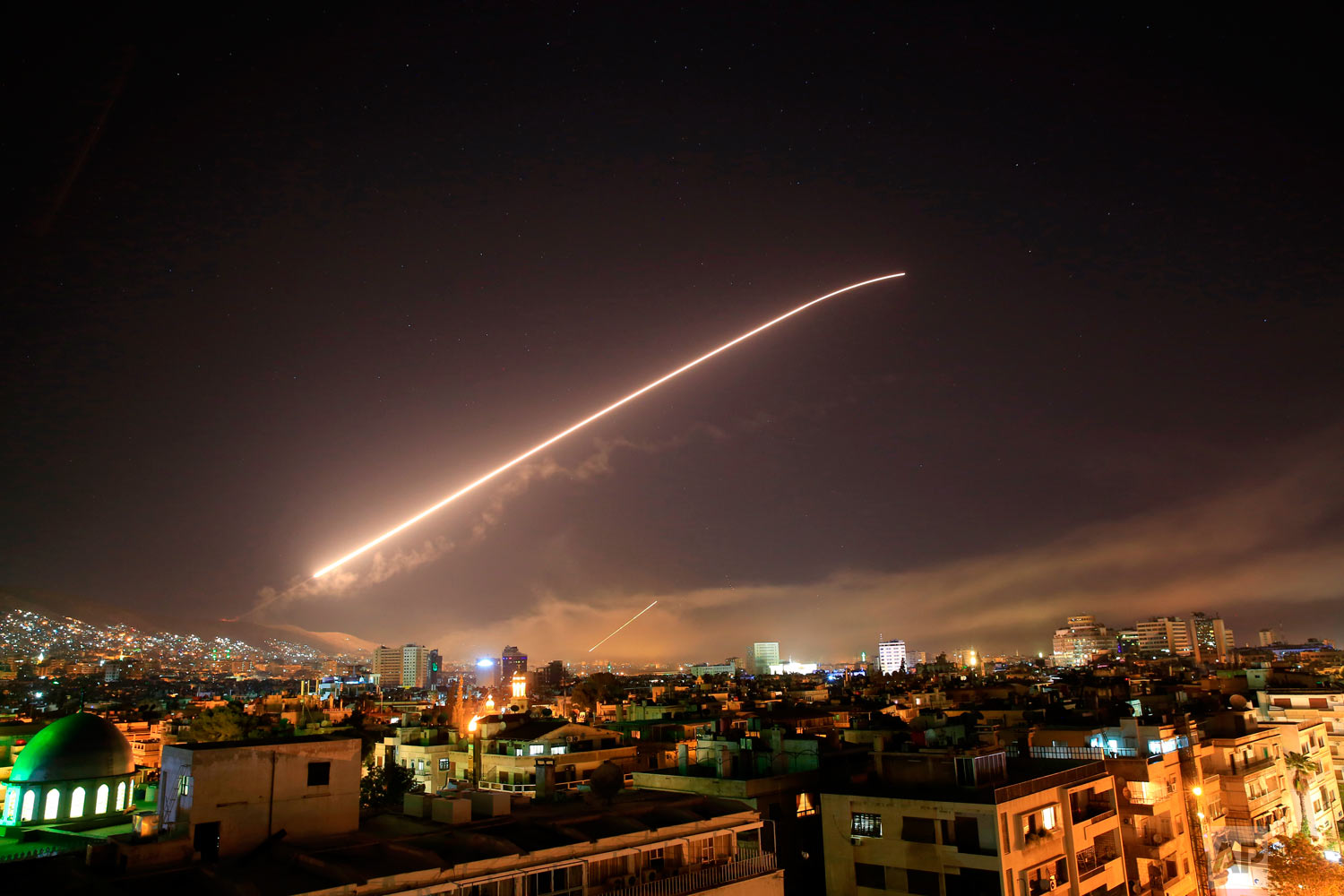  The Damascus sky lights up missile fire as the U.S. launches an attack on Syria targeting different parts of the capital early Saturday, April 14, 2018. Syria's capital has been rocked by loud explosions that lit up the sky with heavy smoke as U.S. 