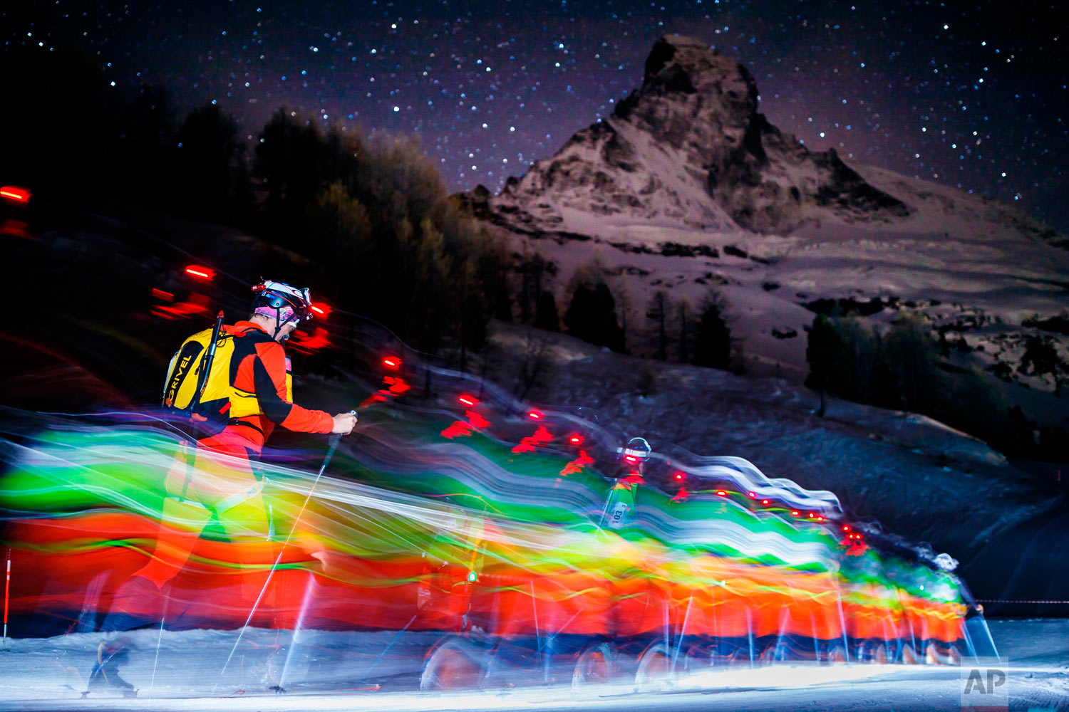 In this photo taken with slow shutter speed, competitors climb in front of the Matterhorn mountain at the start of the 21st Glacier Patrol race in Stafel outside the ski resort of Zermatt, Switzerland on April 17, 2018. The Glacier Patrol (Patrouille des Glaciers in French), organized by the Swiss Army, takes place from April 17 to 21. Highly-experienced hiker-skiers trek for over 53km (3994m ascent and 4090m descent) along the Haute Route along the Swiss-Italian border from Zermatt to Verbier. (Valentin Flauraud/Keystone via AP)