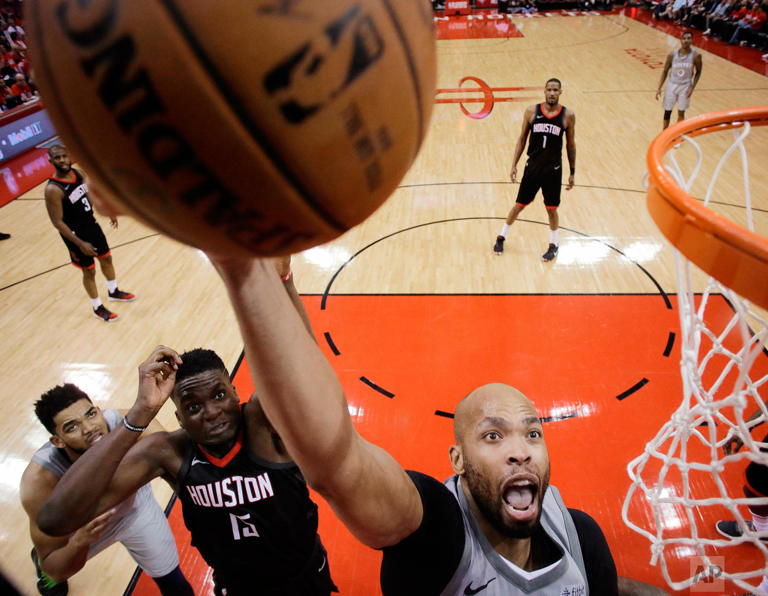  Minnesota Timberwolves forward Taj Gibson, right, shoots as Houston Rockets center Clint Capela (15) defends during the second half in Game 2 of a first-round NBA basketball playoff series, Wednesday, April 18, 2018, in Houston. (AP Photo/Eric Chris