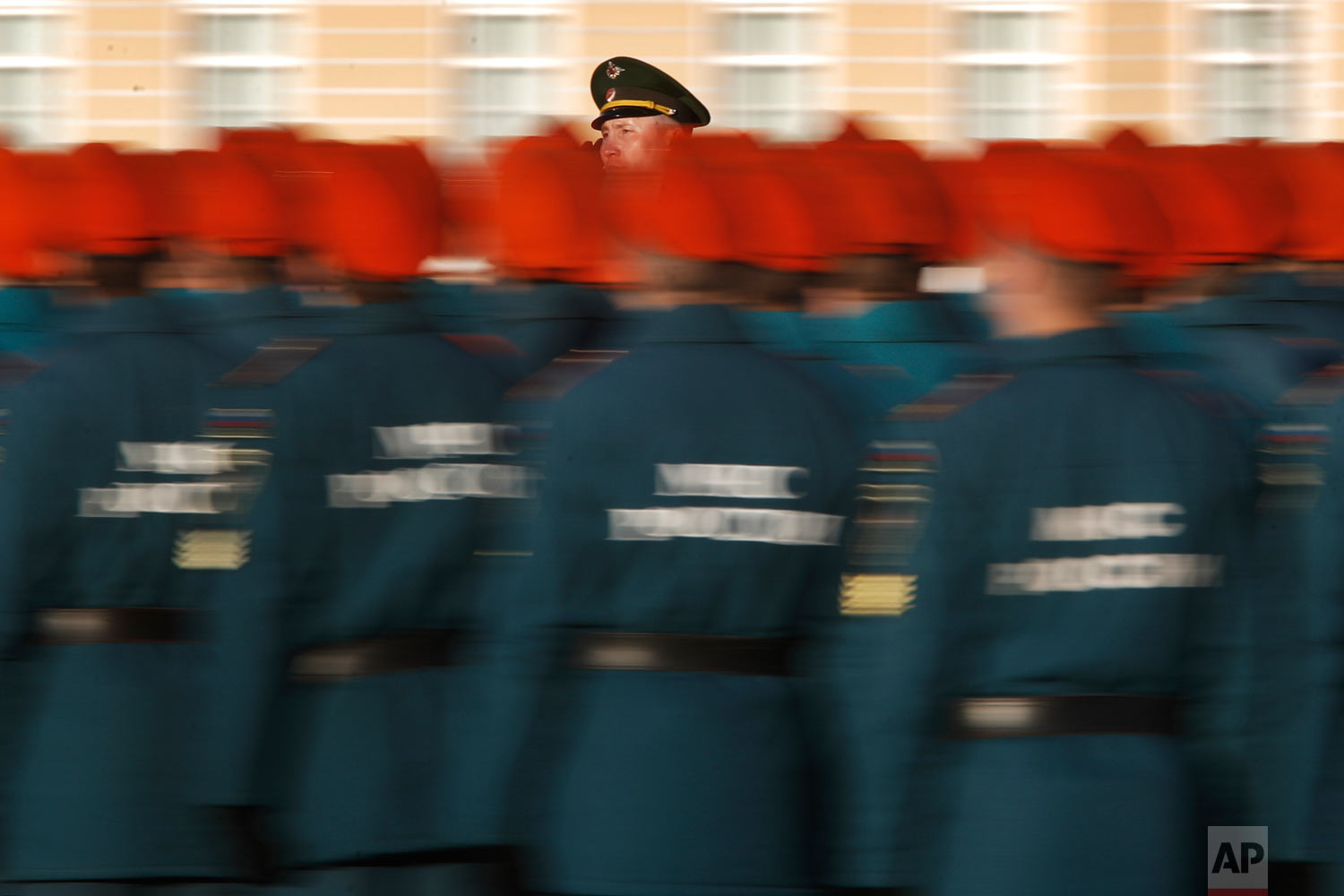  A commander rides a car past troops greeting them during a rehearsal for the Victory Day military parade which will take place at Dvortsovaya (Palace) Square on May 9 to celebrate 73 years after the victory in WWII, in St.Petersburg, Russia, Thursda