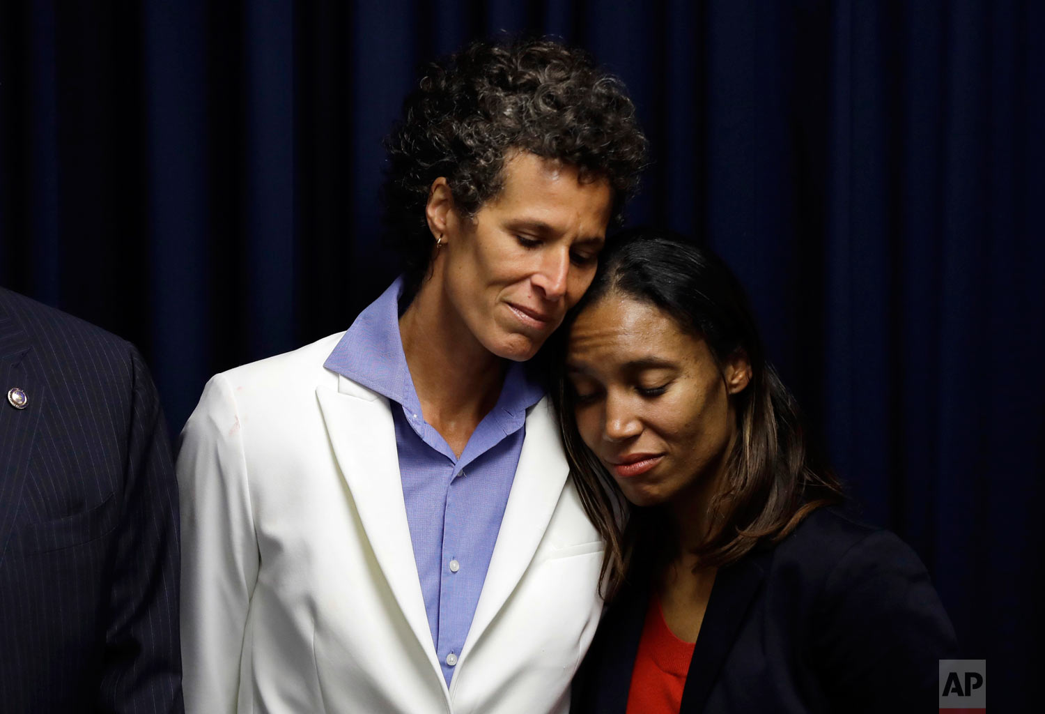  Bill Cosby accuser Andrea Constand, center, embraces prosecutor Kristen Feden, right, as District Attorney Kevin Steele listens during a news conference after Cosby was found guilty in his sexual assault trial, Thursday, April 26, 2018, in Norristow