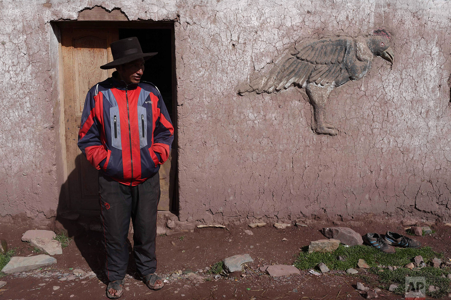  In this March 2, 2018 photo, Miguel Rocco stands in front of his home in Pitumarca, Peru. (AP Photo/Martin Mejia) 