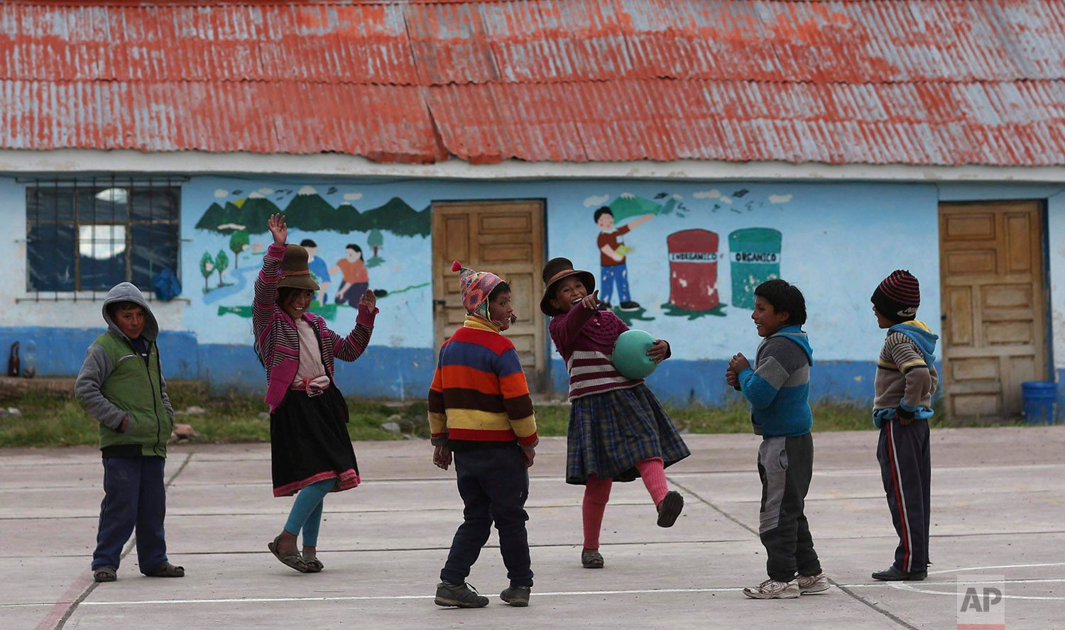  In this April 4, 2018 photo, children play in their schoolyard in Pitumarca, Peru.(AP Photo/Martin Mejia)
 