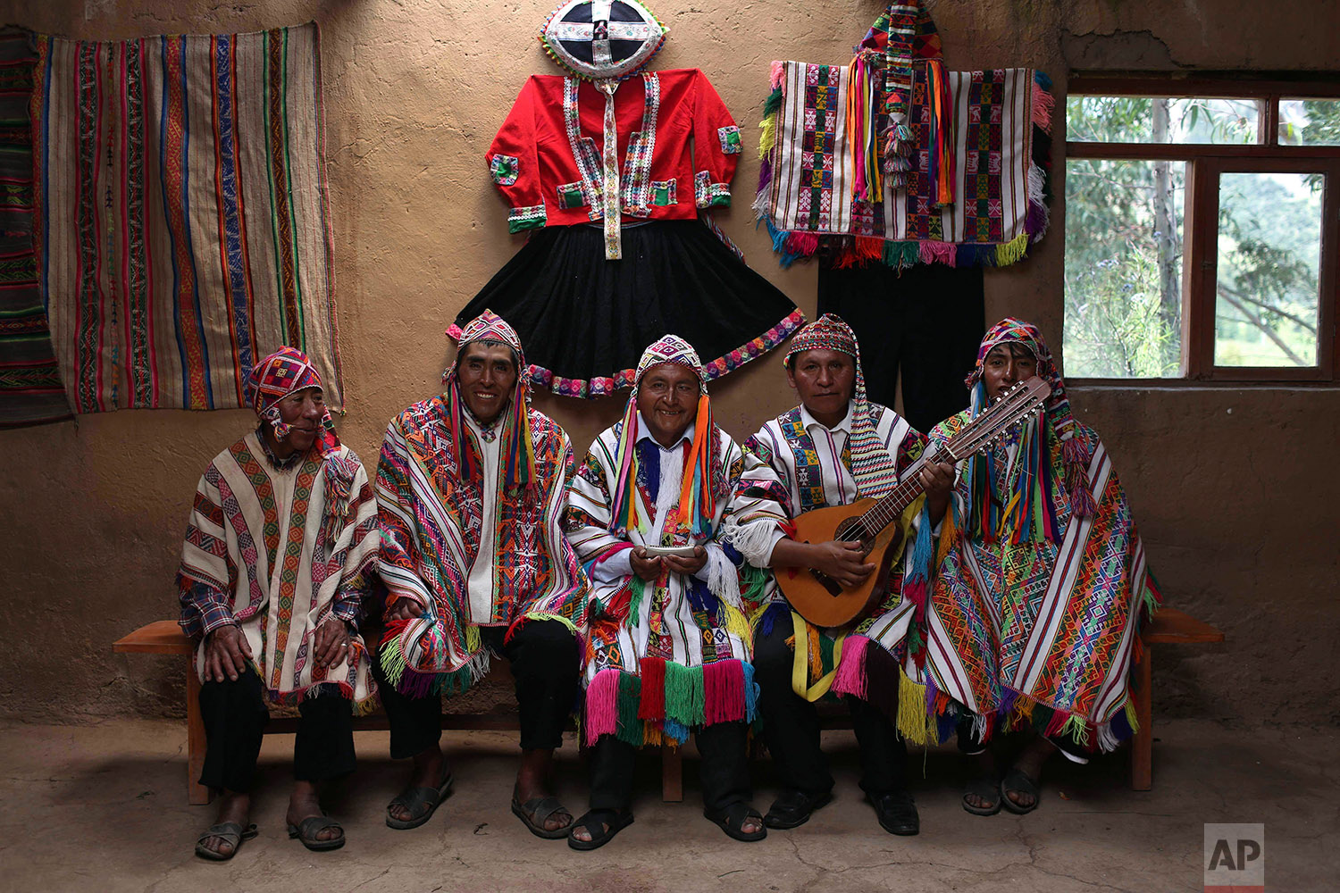  In this April 4, 2018 photo, a group of musicians pose for a portrait in Pitumarca, Peru, near Rainbow Mountain. (AP Photo/Martin Mejia) 