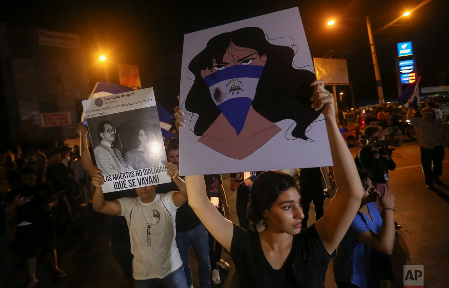 Demonstrators protest in honor of those who have died during anti-government protests in Managua, Nicaragua, Tuesday, April 24, 2018. Authorities released some student protesters arrested during anti-government demonstrations over the past week and the Roman Catholic Church agreed Tuesday to act as a mediator as President Daniel Ortega sought to lower tensions in Nicaragua. (AP Photo/Alfredo Zuniga)