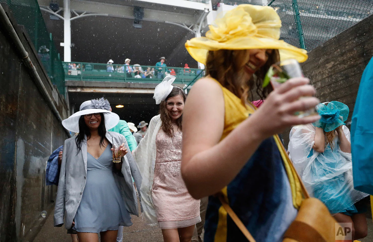 Fans walk to the infield before the 144th running of the Kentucky Derby horse race at Churchill Downs Saturday, May 5, 2018, in Louisville, Ky. (AP Photo/John Minchillo)