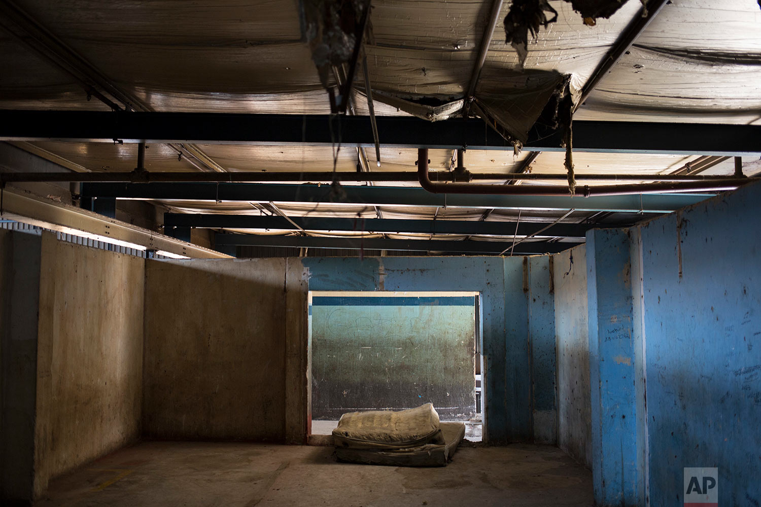  A mattress is left behind in an abandoned building where squatters were evicted months earlier. March 28, 2018. (AP Photo/Bram Janssen) 