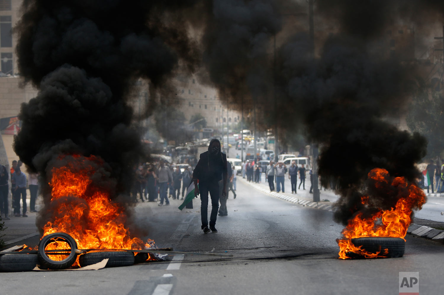 Palestinians clash with Israeli troops following a protest against the U.S. decision to relocate it's Israeli embassy to Jerusalem, in the West Bank city of Bethlehem, Monday, May 14, 2018. (AP Photo/Majdi Mohammed)