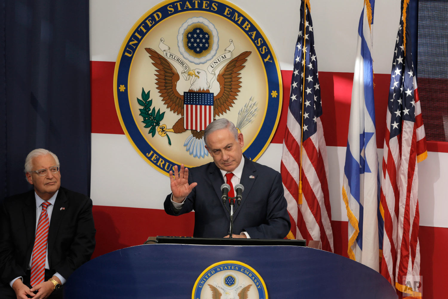 Israeli Prime Minister Benjamin Netanyahu speaks as U.S. Ambassador to Israel David Friedman listens during the opening ceremony of the new US embassy in in Jerusalem, Monday, May 14, 2018. (AP Photo/Sebastian Scheiner)