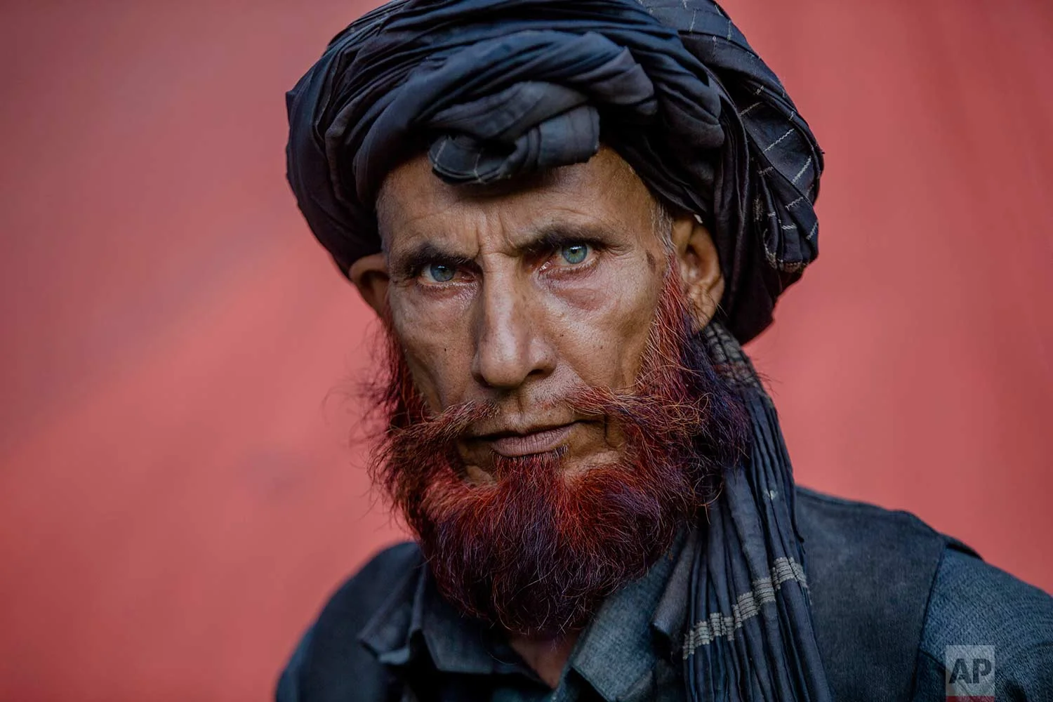 In this May 9, 2018, photo, Dawood Khatana, a Kashmiri nomadic Bakarwal poses for a photograph at a camp in Newa, 29 kilometers (18 miles) south of Srinagar, Indian controlled Kashmir. (AP Photo/Dar Yasin)