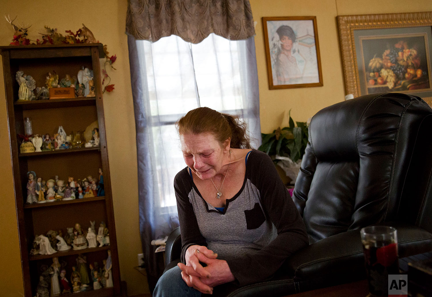  Linda Green cries in her home while awaiting trial after her latest arrest on charges of public intoxication in LaFollette, Tenn., Tuesday, March 27, 2018. "I've had a hard life. I'm on the edge. I feel like I'm going to have a nervous breakdown. ..