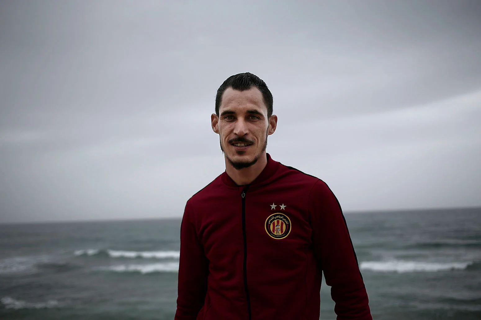In this Saturday, April 14, 2018 photo, Khaled Arfawy, 25, who wants to leave Tunisia, poses at the beach where migrants leave for Italy, in Ras Jebel, Tunisia. (AP Photo/Nariman El-Mofty)