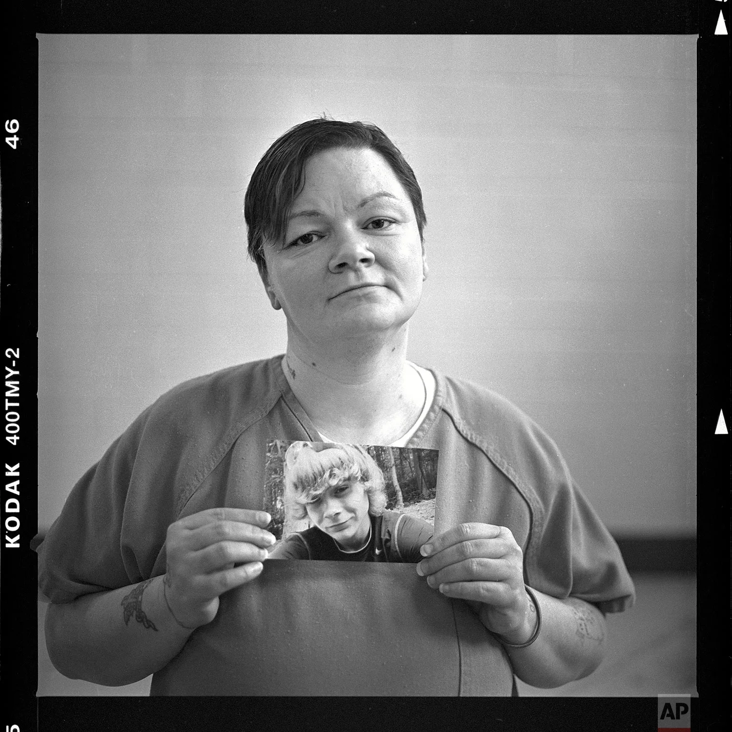 Mary Sammons, age 41, holds a picture of her son, Micah, 20, who was murdered March 23, as she is photographed in her cell at the Campbell County Jail in Jacksboro, Tenn., Wednesday, April 18, 2018. Sammons suspects her son’s murder was drug-related. “I always pictured my kids burying me, not me having to bury my children. Young kids are losing their life over bad dope. This is crazy. It’s so not worth it. He was a pretty boy. He was beautiful.” (AP Photo/David Goldman) 