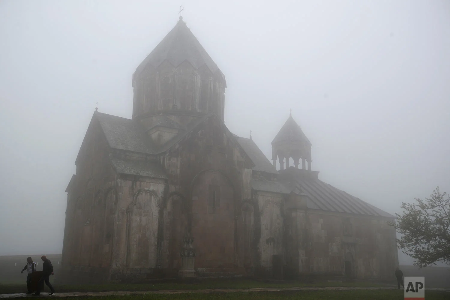 In this Saturday, May 12, 2018, workers carry a medal box at Gandzasar monastery near the village of Vank. (AP Photo/Thanassis Stavrakis)