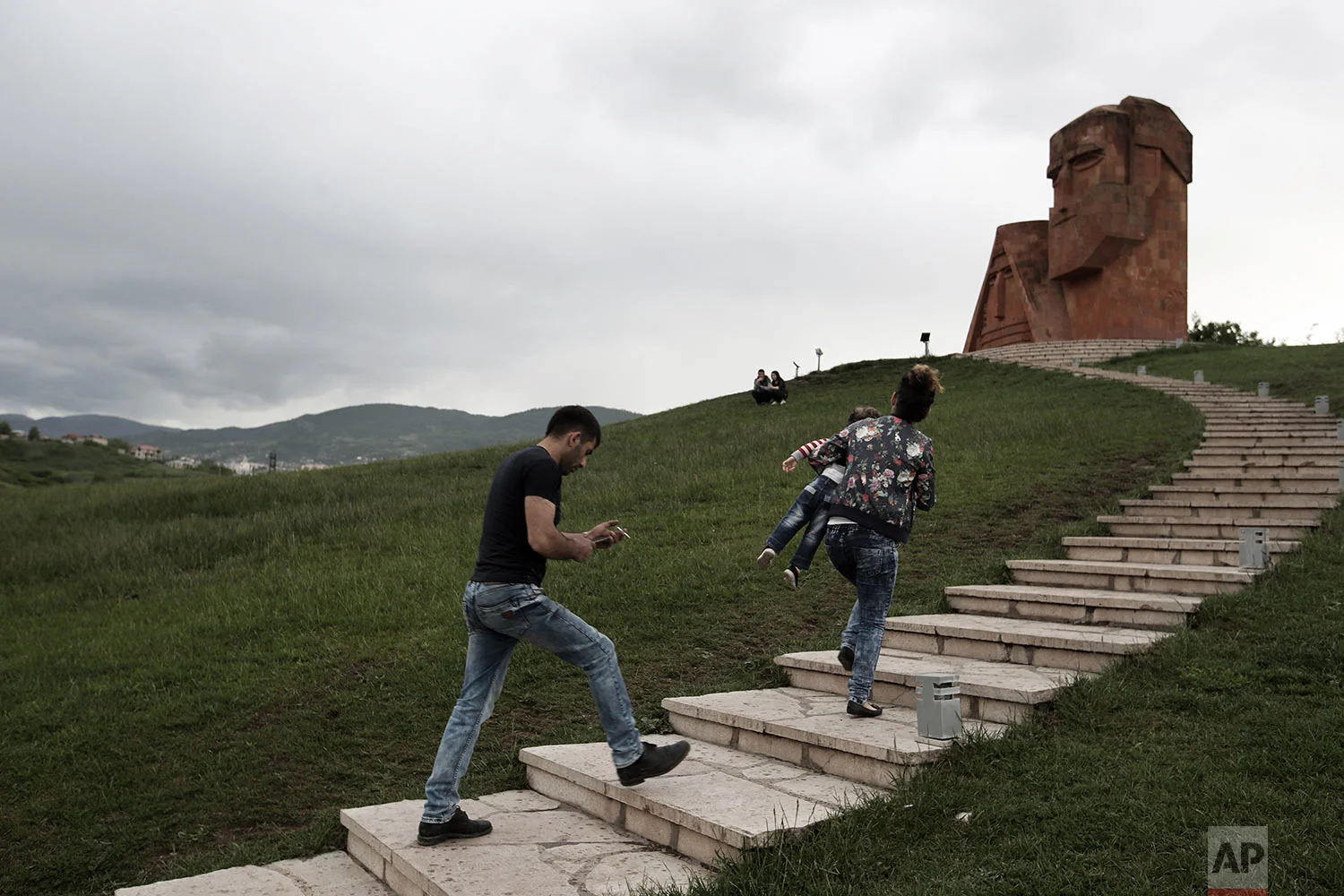 In this Friday, May 11, 2018, people visit the monument ''We are our mountains'' in Stepanakert. (AP Photo/Thanassis Stavrakis)