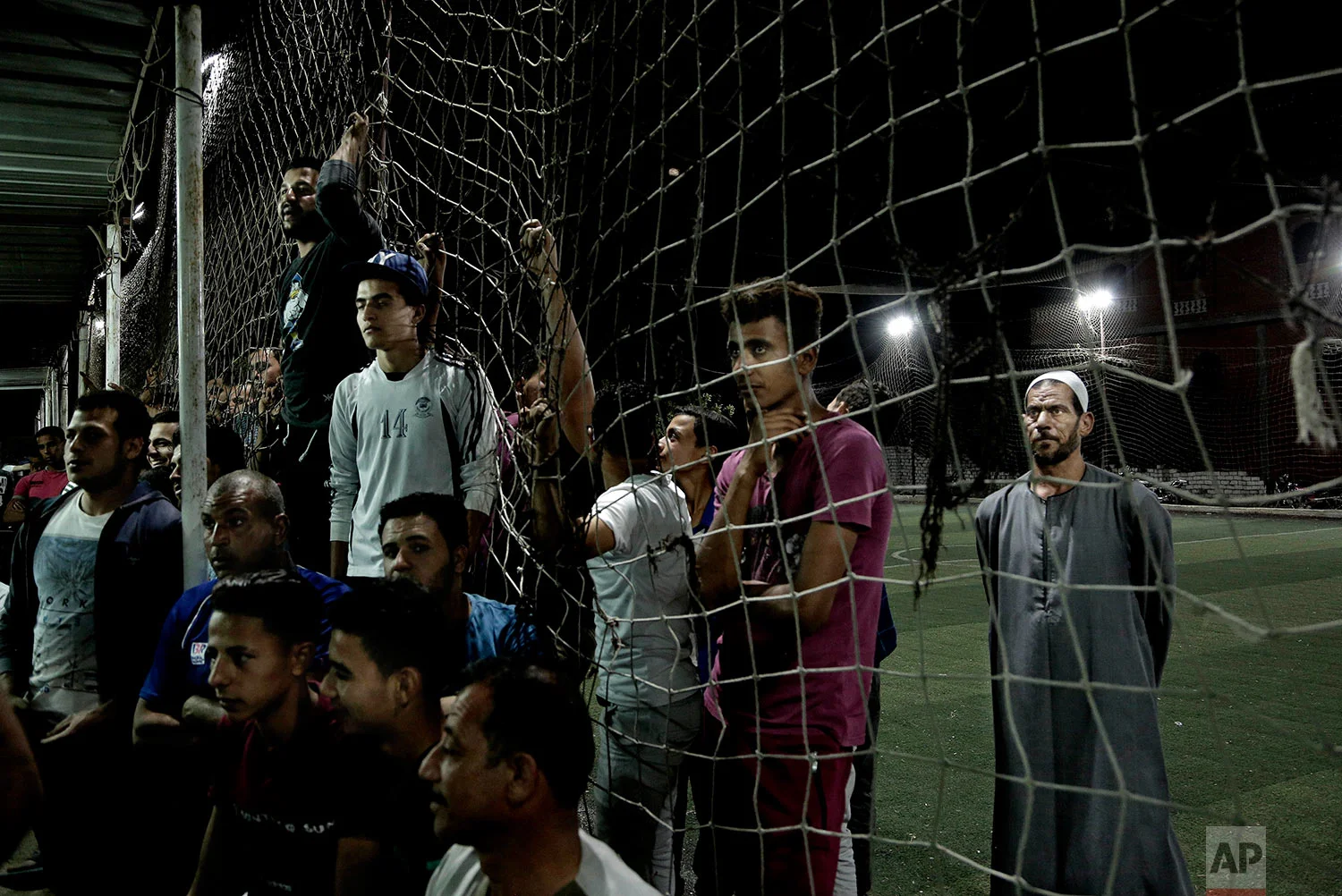 Watching Salah in the Liverpool vs Roma match in Nagrig. (AP Photo/Nariman El-Mofty)