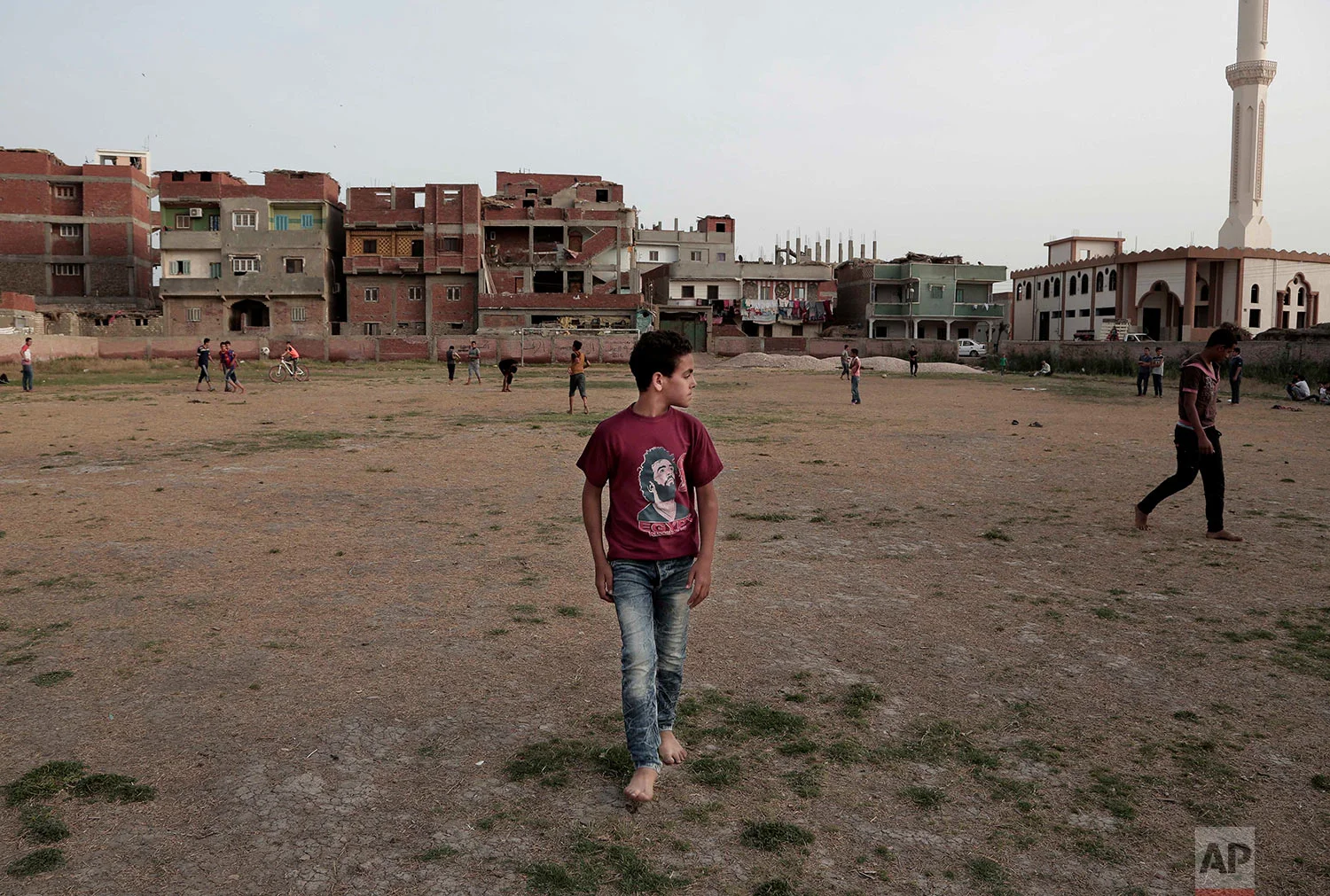 Boys play football at the sports and youth center in Mohamed Salah's hometown Nile delta village of Nagrig, Egypt, May 2, 2018. (AP Photo/Nariman El-Mofty)