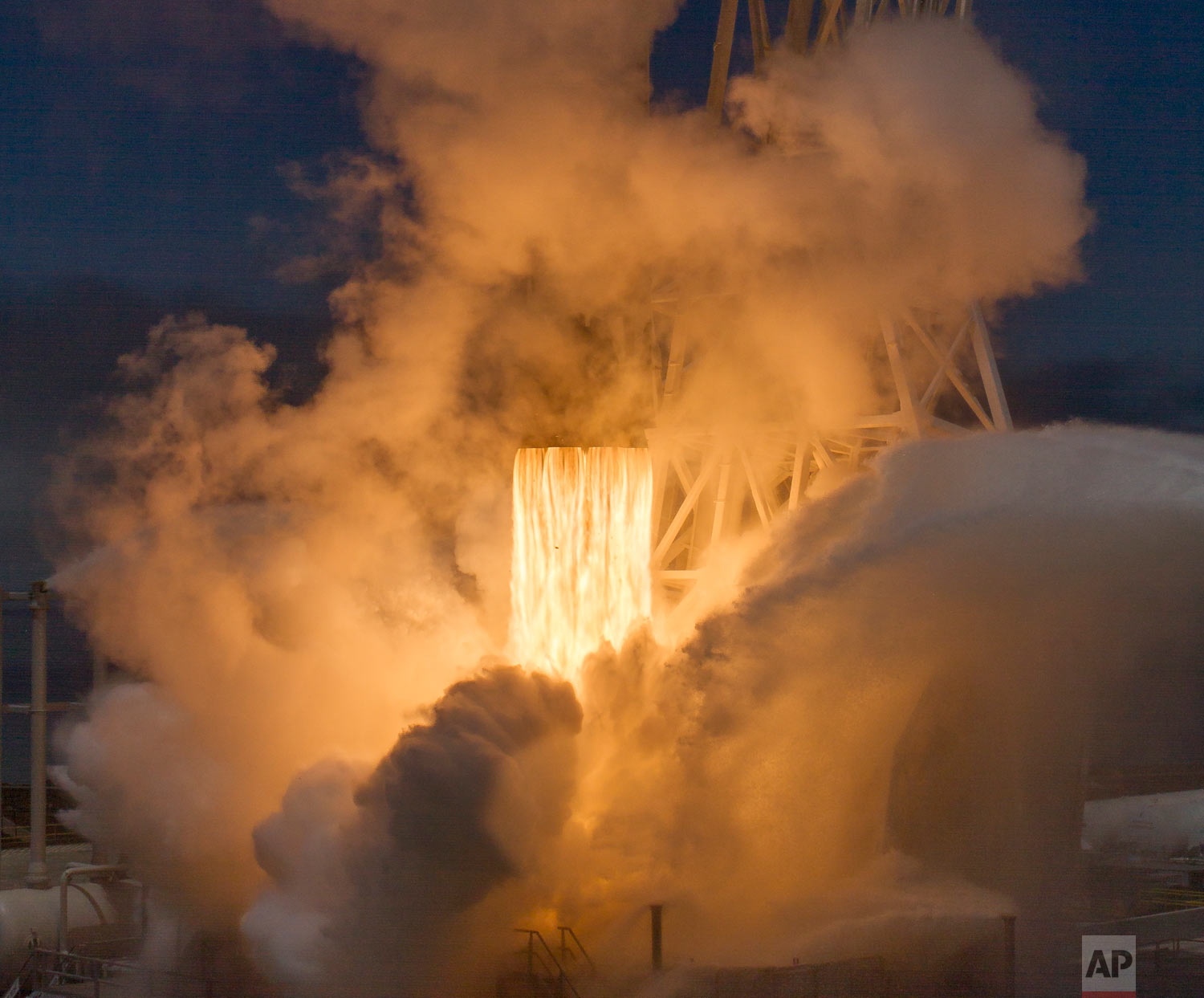  In this photo provided by NASA, a SpaceX Falcon 9 rocket with a pair of U.S.-German science satellites and five commercial communications satellites takes off from Space Launch Complex 4E at Vandenberg Air Force Base in California on Tuesday, May 22