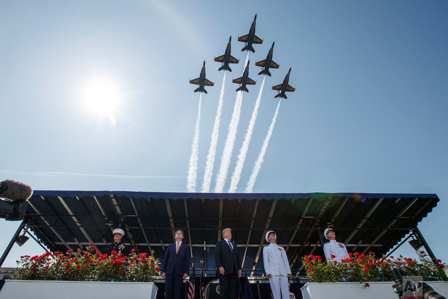  President Donald Trump looks on as the Blue Angels fly over the graduation ceremony at the U.S. Naval Academy, Friday, May 25, 2018, in Annapolis, Md. (AP Photo/Evan Vucci) 