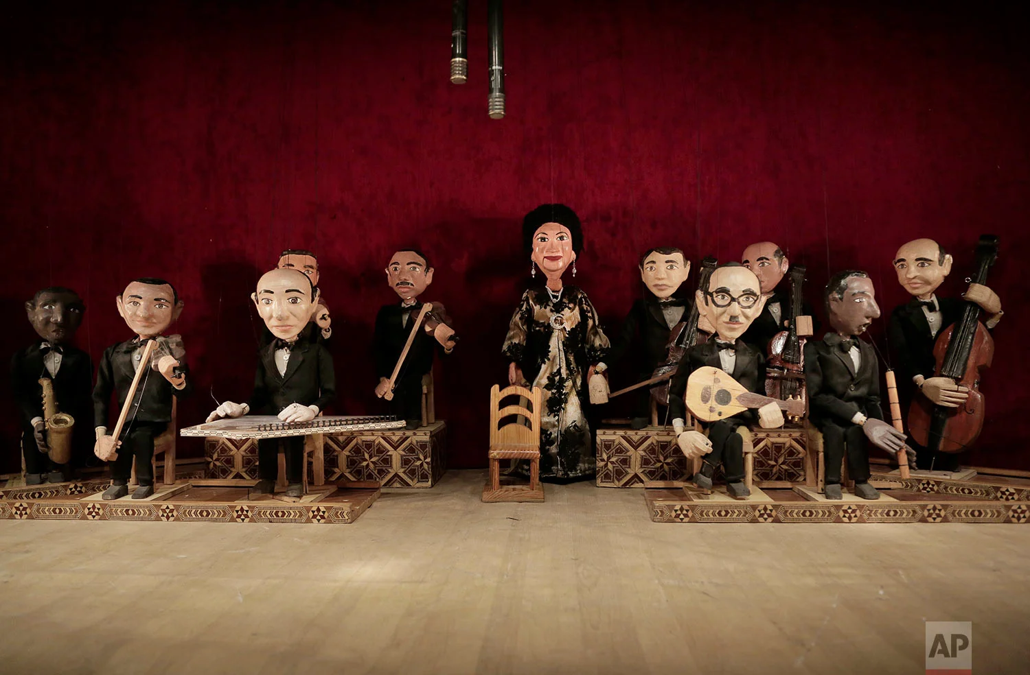 Marionettes of Umm Kalthoum, the most famed singer of classical Arabic music, and her band, made by Egyptian artist Mohamed Fawzi Bakkar, perform at the El Sawy Cultural Center, in Cairo, Egypt, May 3, 2018. (AP Photo/Nariman El-Mofty)