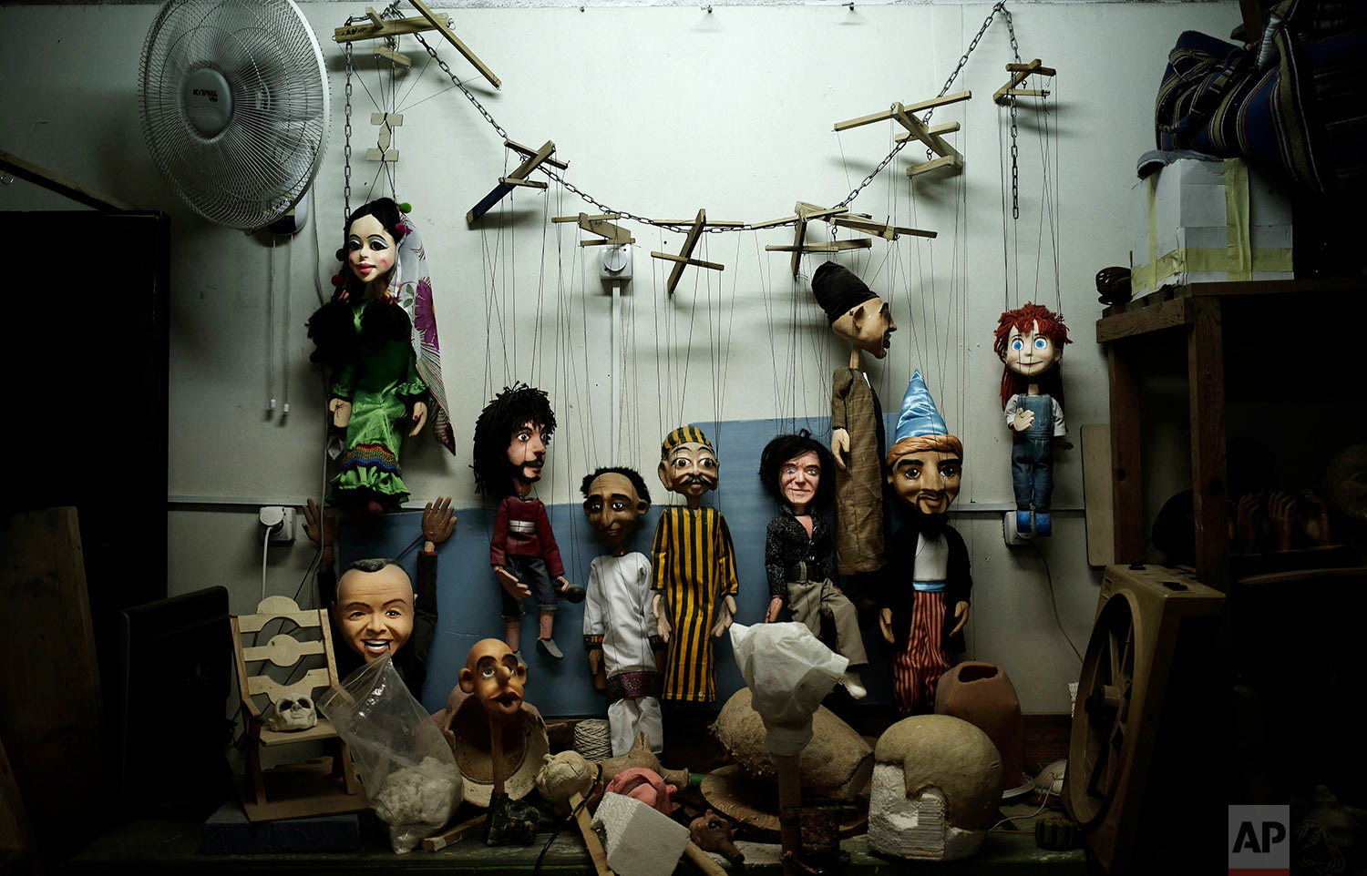 Puppets hang on the wall at the workshop of Egyptian artist Mohamed Fawzi Bakkar, in Cairo, Egypt, April 24, 2018. Bakkar designs and builds marionettes from scratch, hoping to revive a traditional art. (AP Photo/Nariman El-Mofty)