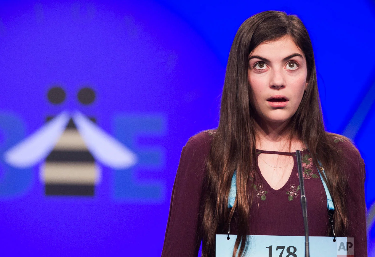 Isabel Messina, 13, from Annapolis, Md., spells her word during the second round of the Scripps National Spelling Bee in Oxon Hill, Md., Tuesday, May 29, 2018. (AP Photo/Cliff Owen)
